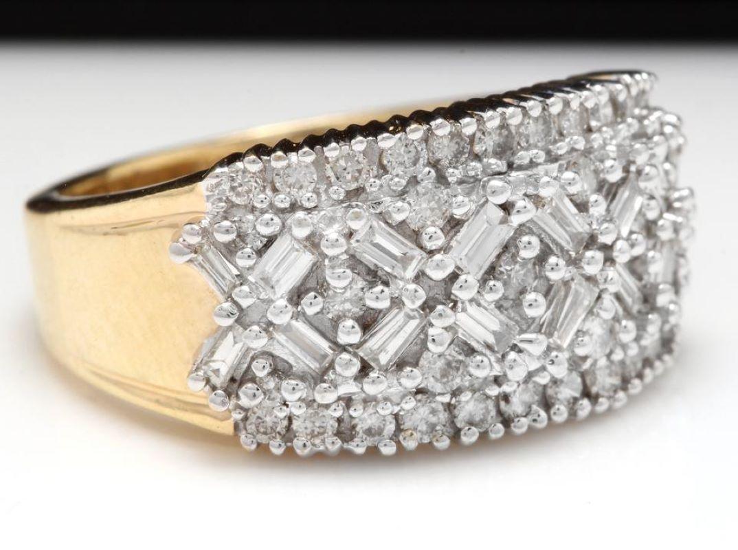 Splendid 1.25 Carats Natural Diamond 14K Solid Yellow Gold Ring

Stamped: 14K

Total Natural Baguette & Round Cut Diamonds Weight is: Approx. 1.25 Carats (color H-I / Clarity VS2-SI2)

The width of the ring is: 18.88mm

Ring size: 7 (we offer free