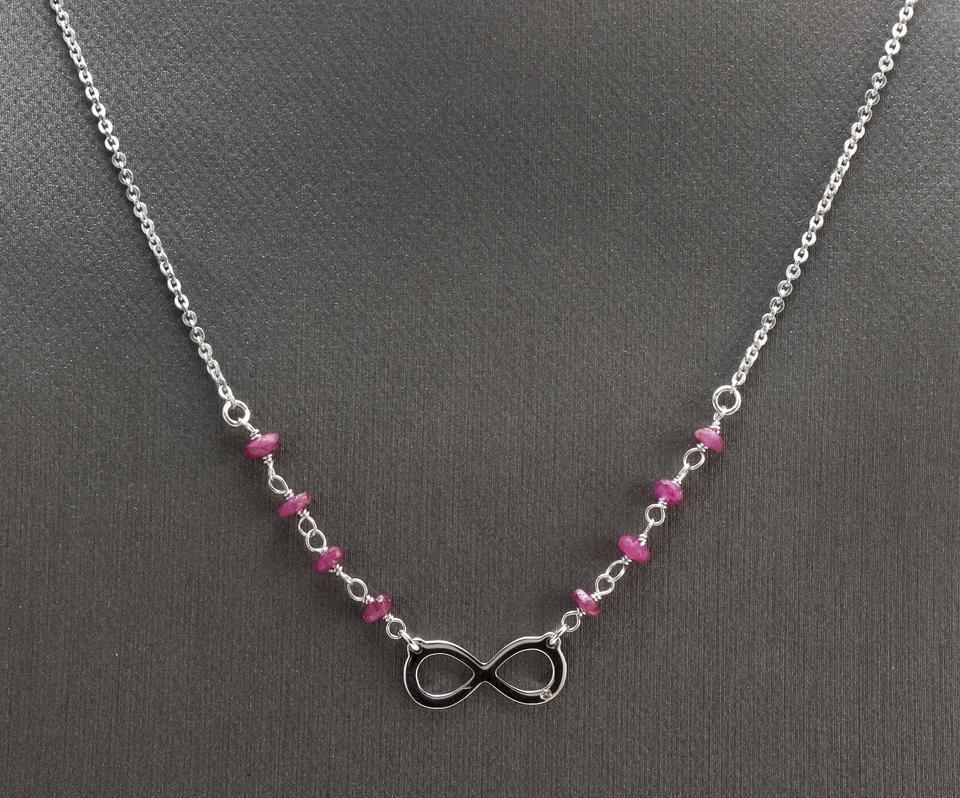 Splendid 14k Solid White Gold Infinity Necklace with Natural Diamond Accent and Rough Rubies

Amazing looking piece!

Stamped: 14k

Natural Diamond Weight: 0.005ct (H / SI2)

Natural Rough Rubies

Chain Length is: Adjustable

Infinity Sign Measures: