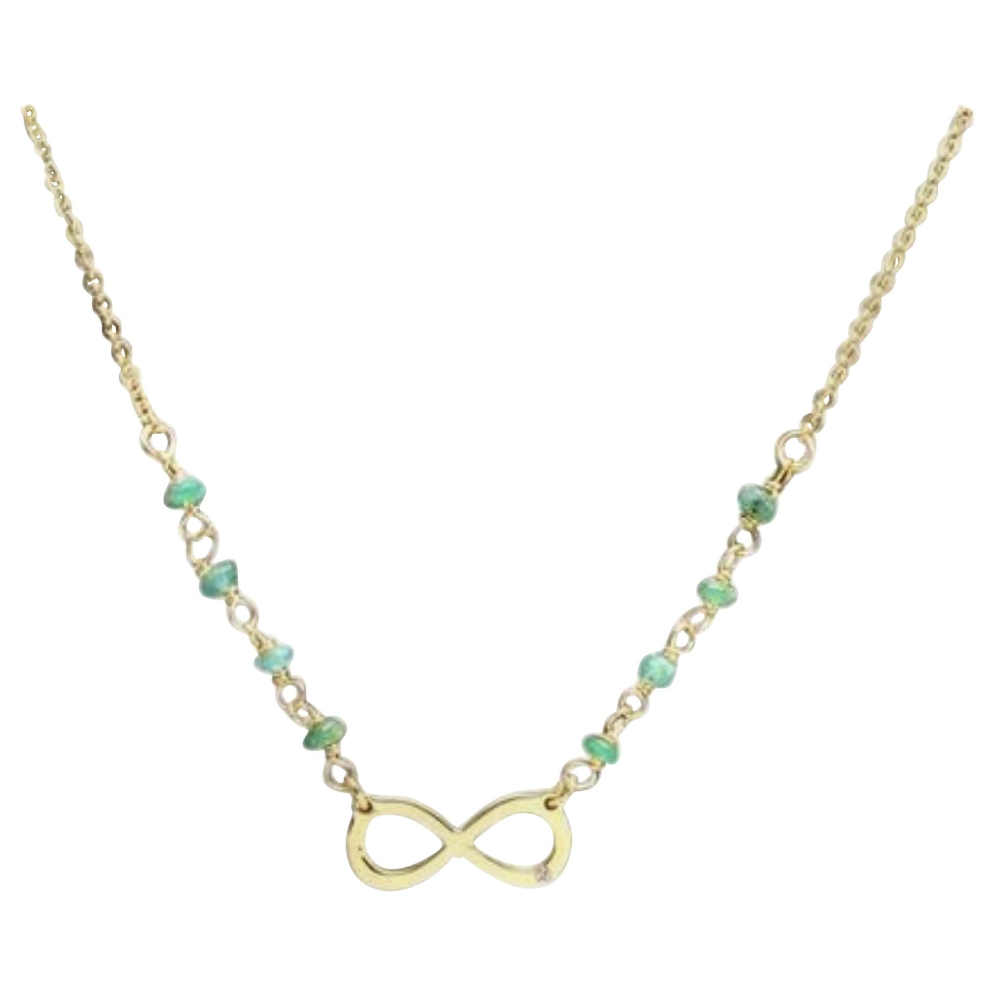 14 Karat Solid Gold Infinity Necklace with Natural Diamond Accent and Emeralds