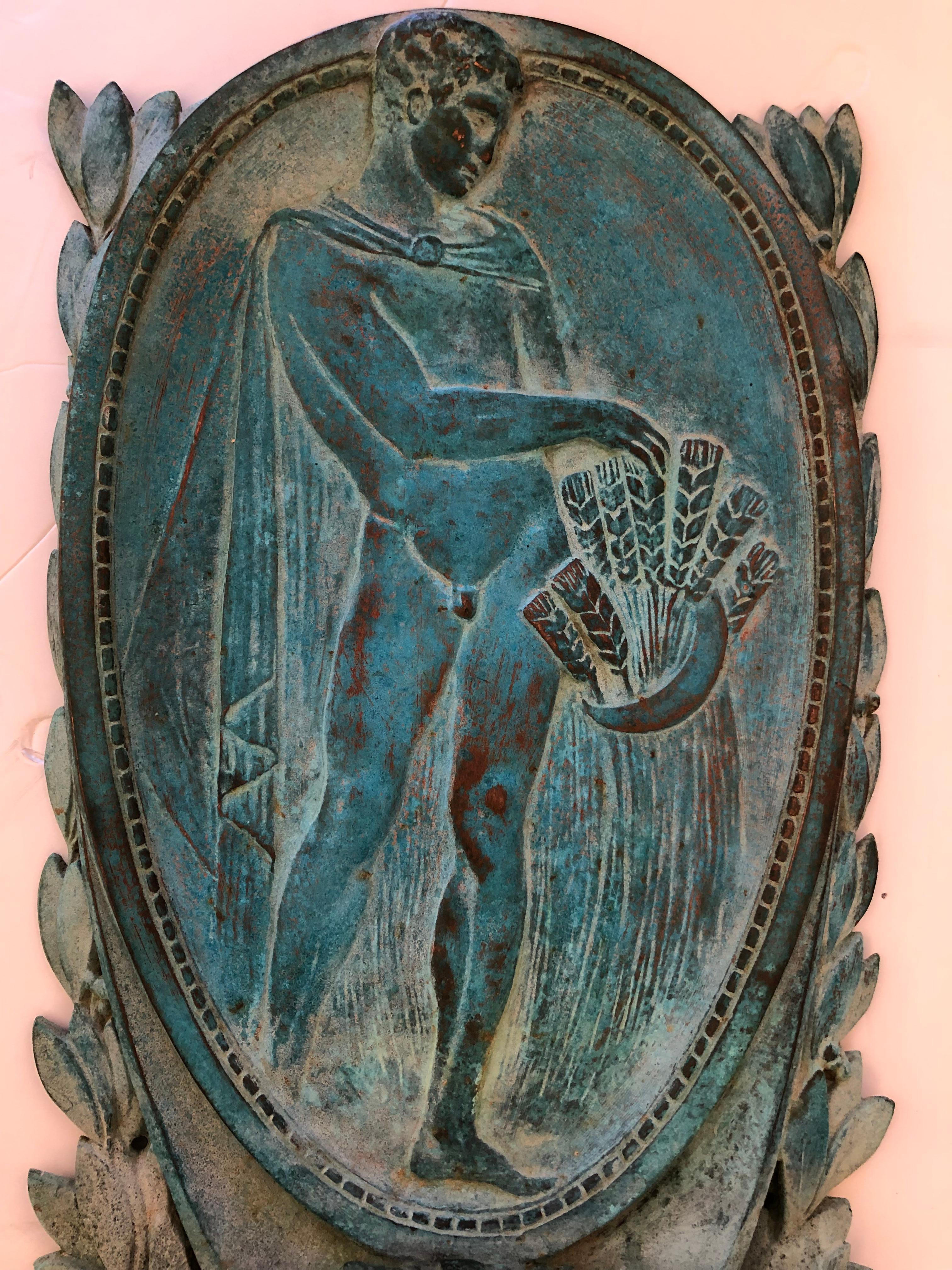 Utterly beautiful and romantic oval bronze French wall plaque in relief having gorgeous torquoise patina. The subject is a classical male nude of a young hunter with arrows in a quiver. Can be hung outdoors or inside.