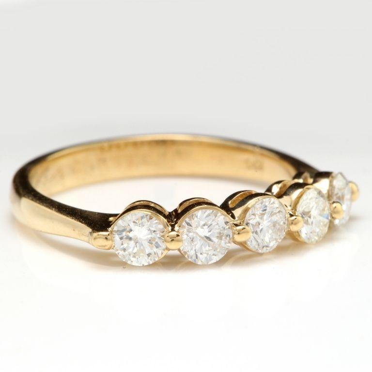 Splendid 0.90 Carats Natural Diamond 14K Solid Yellow Gold Ring

Stamped: 14K

Total Natural Round Cut Diamonds Weight: Approx. 0.90 Carats (color G-H / Clarity SI1-SI2)

The width of the ring is: 3.68mm

Ring size: 7 (we offer free re-sizing upon