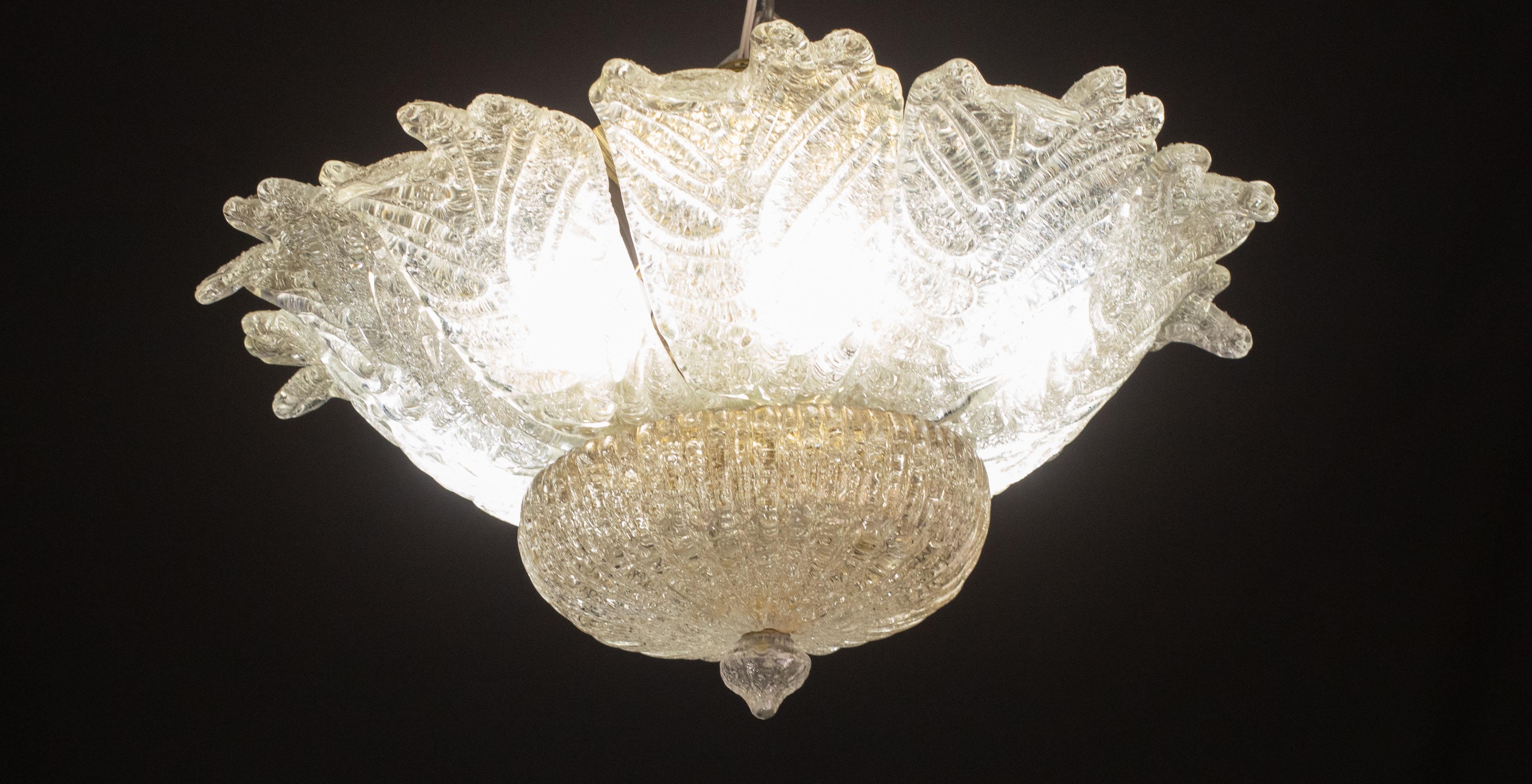 Splendid Murano glass ceiling lamp in coloured trasparent

Period: circa 1970.

The light mounts 7 standard European e14 lamp holders.

Excellent vintage condition.

Height measures 30 centimeters from the ceiling, diameter about 50 centimeters.