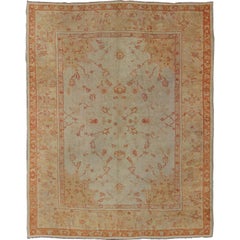 Antique Turkish Oushak Carpet In Red, Cream, and Yellow with A Muted Design 