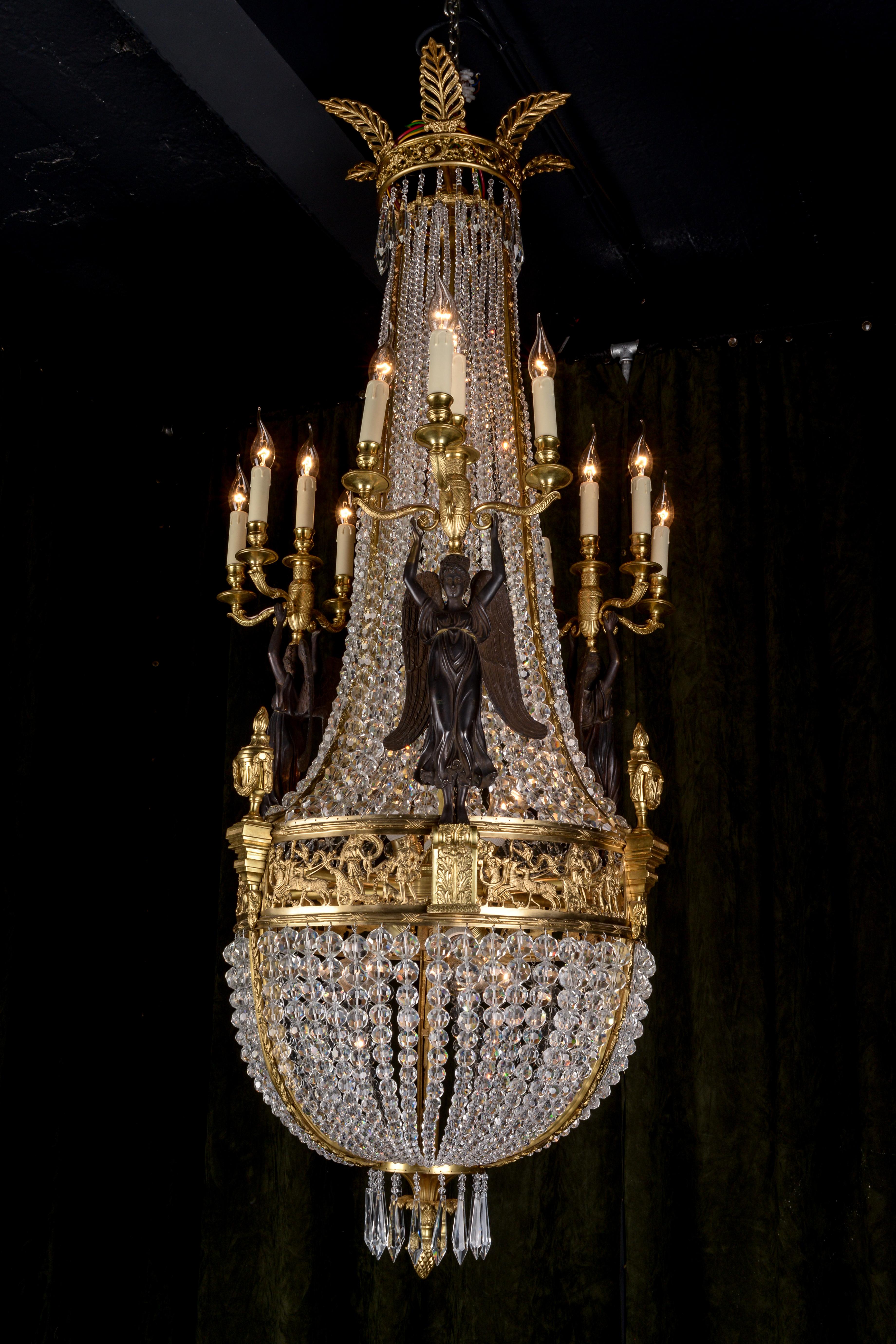 Splendid chandelier after Pierre Phillipe Thomire (1751 – 1843).

Exceptionally fine, engraved and cast Bronze. Basket-formed corpus from hand-cut frenches ball prisms (over 3,600 pieces). Connected through wide, ornamental reliefed and broken