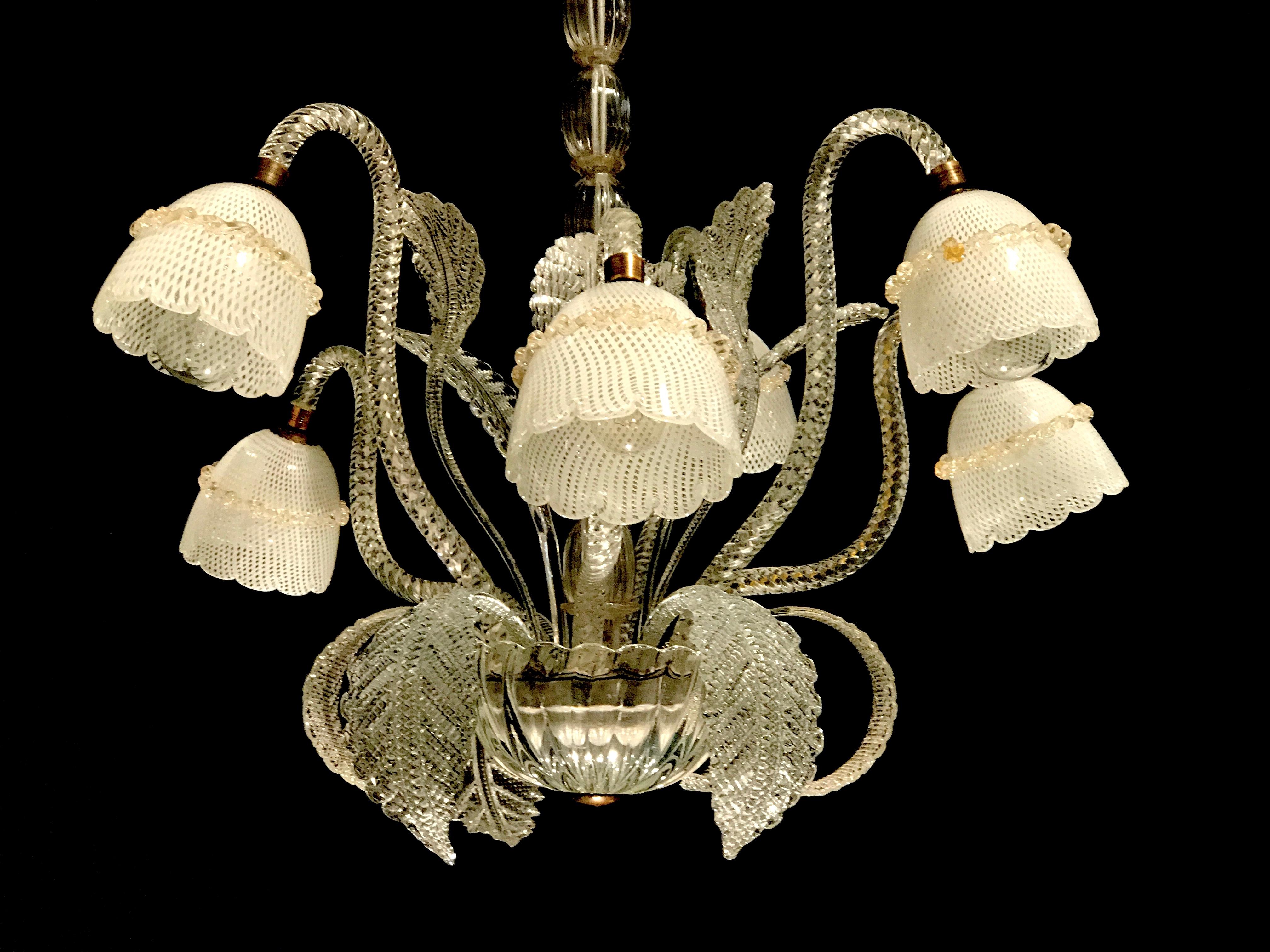 Exquisite craftsmanship with six arms supporting a precious hand blown 'reticello' cups. Perfect vintage condition.
We can rewire for US standards. Six e27 light bulbs.