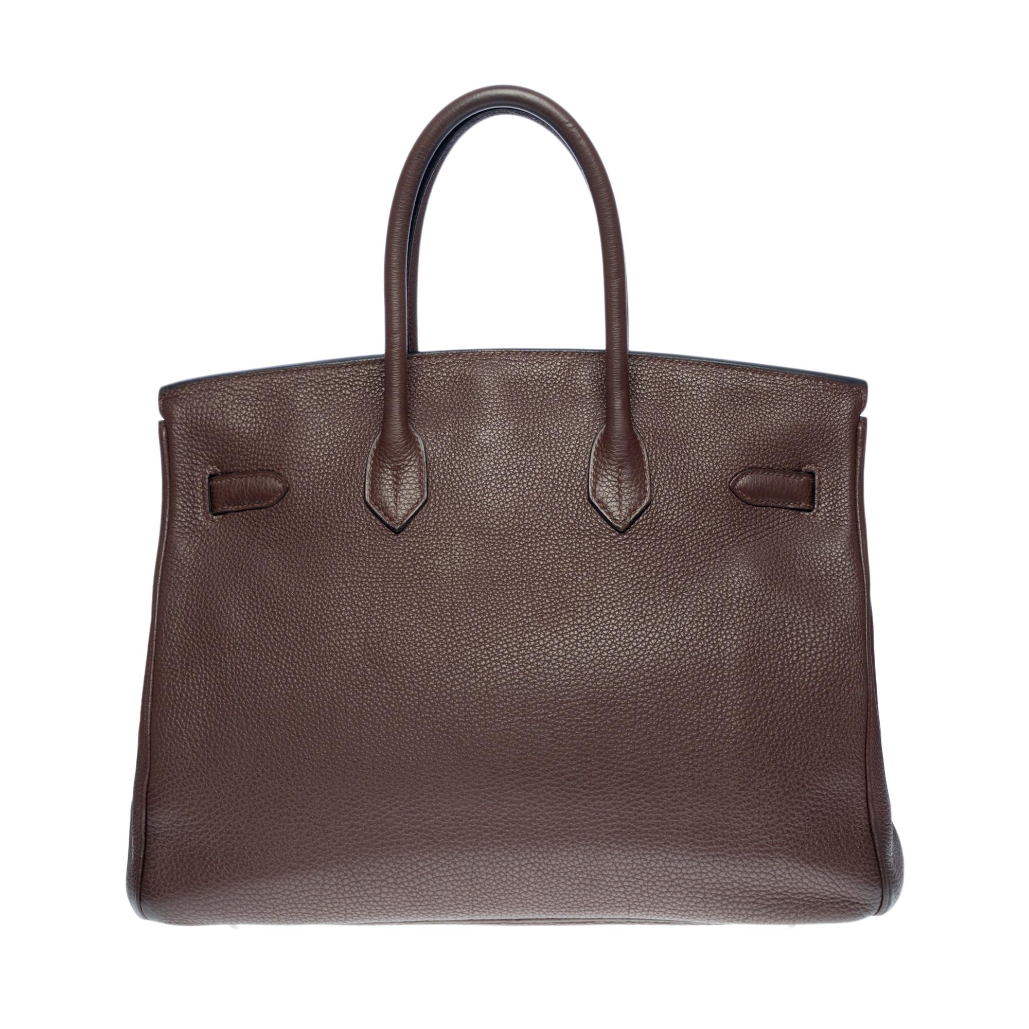Splendid Hermes Birkin 35 cm handbag in brown Taurillon Clémence leather, palladium silver metal hardware, double handle in brown leather allowing a hand carry

Flap closure
Inner lining in brown leather, one zippered pocket, one patch