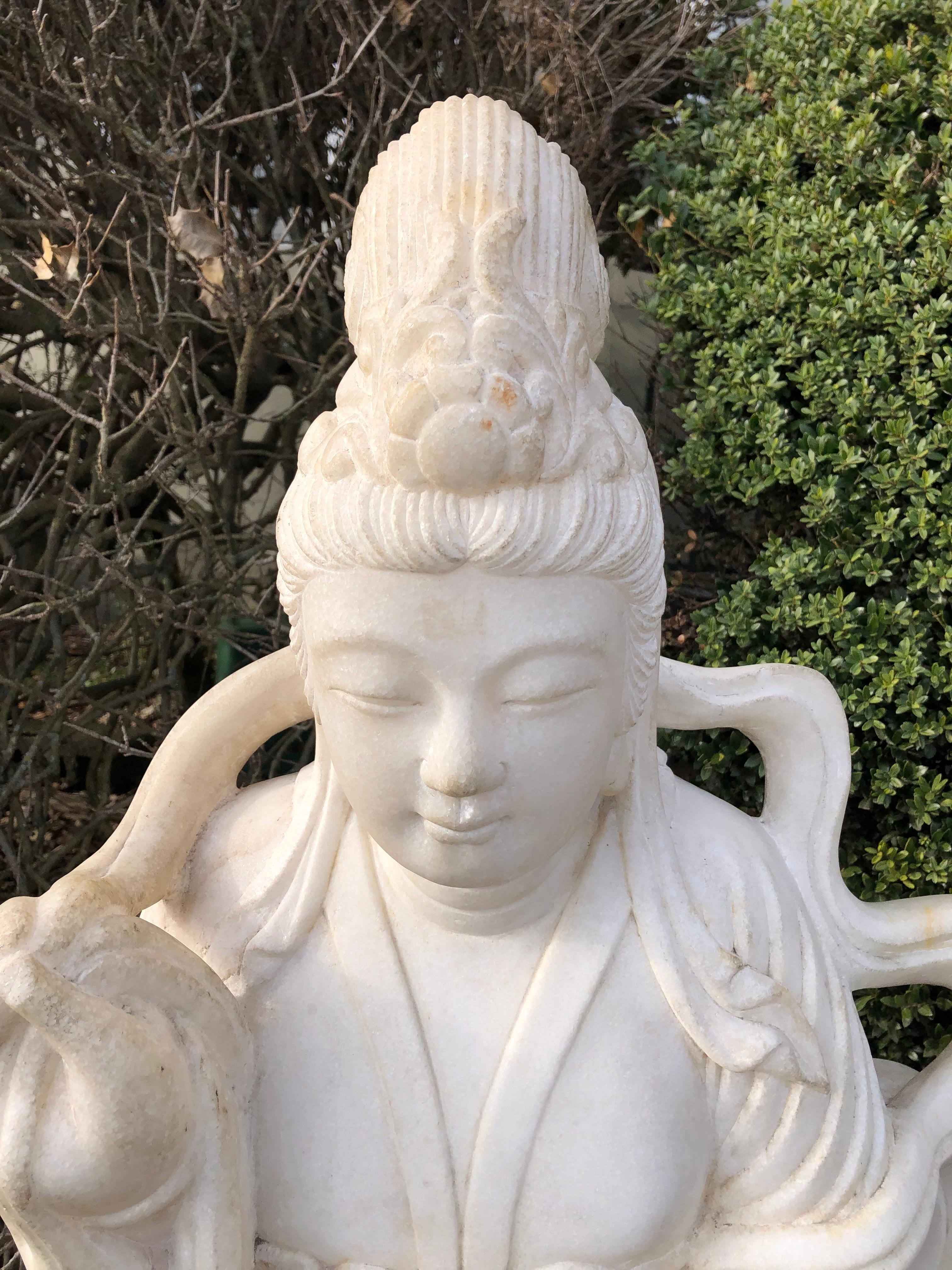Amazing life size beautiful white marble Guan Yin sculpture having meticulous detail and beautiful peaceful expression. Appropriate for display indoors or in the garden.
 In Chinese mythology, Guan Yin  is the goddess of mercy and considered to be