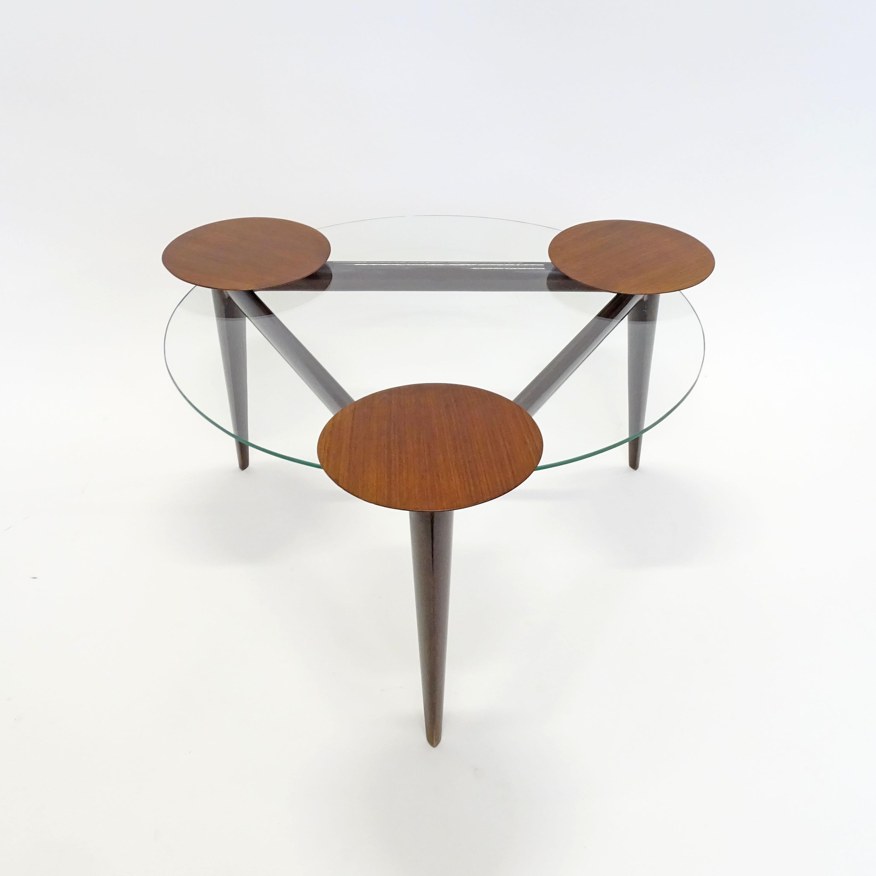 Splendid Italian 1950s coffee table with rotating wooden trays.
Glass top height 38cm
Wood trays height 41cm
Glass top diameter 71cm
Diameter with open trays 100cm
A real talking point piece.