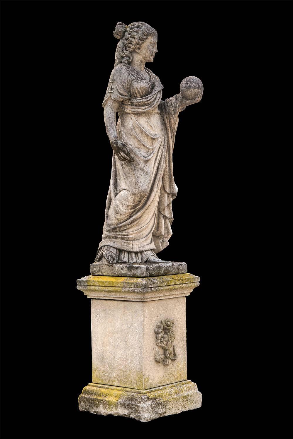 This is a figure of Urania, a Muse, sometimes associated with Astronomy; she holds a celestial orb. 
As a vestal with the Greek drapery throughout the body and
the left hand keeping the world, representing the science and knowledge
on a quadrangular