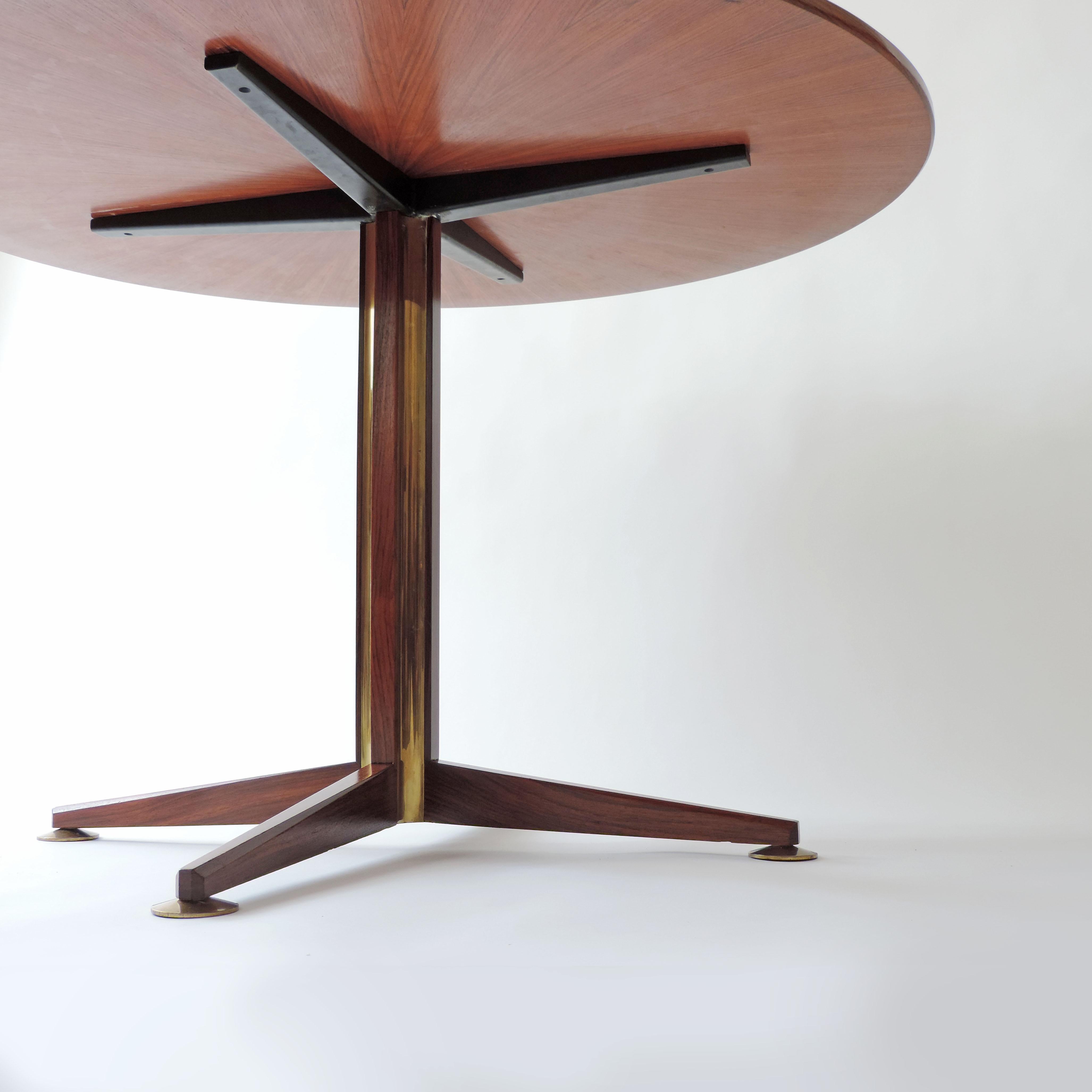 Osvaldo Borsani circular dining table in 
sculpted wood and brass details, Italy, 1960s