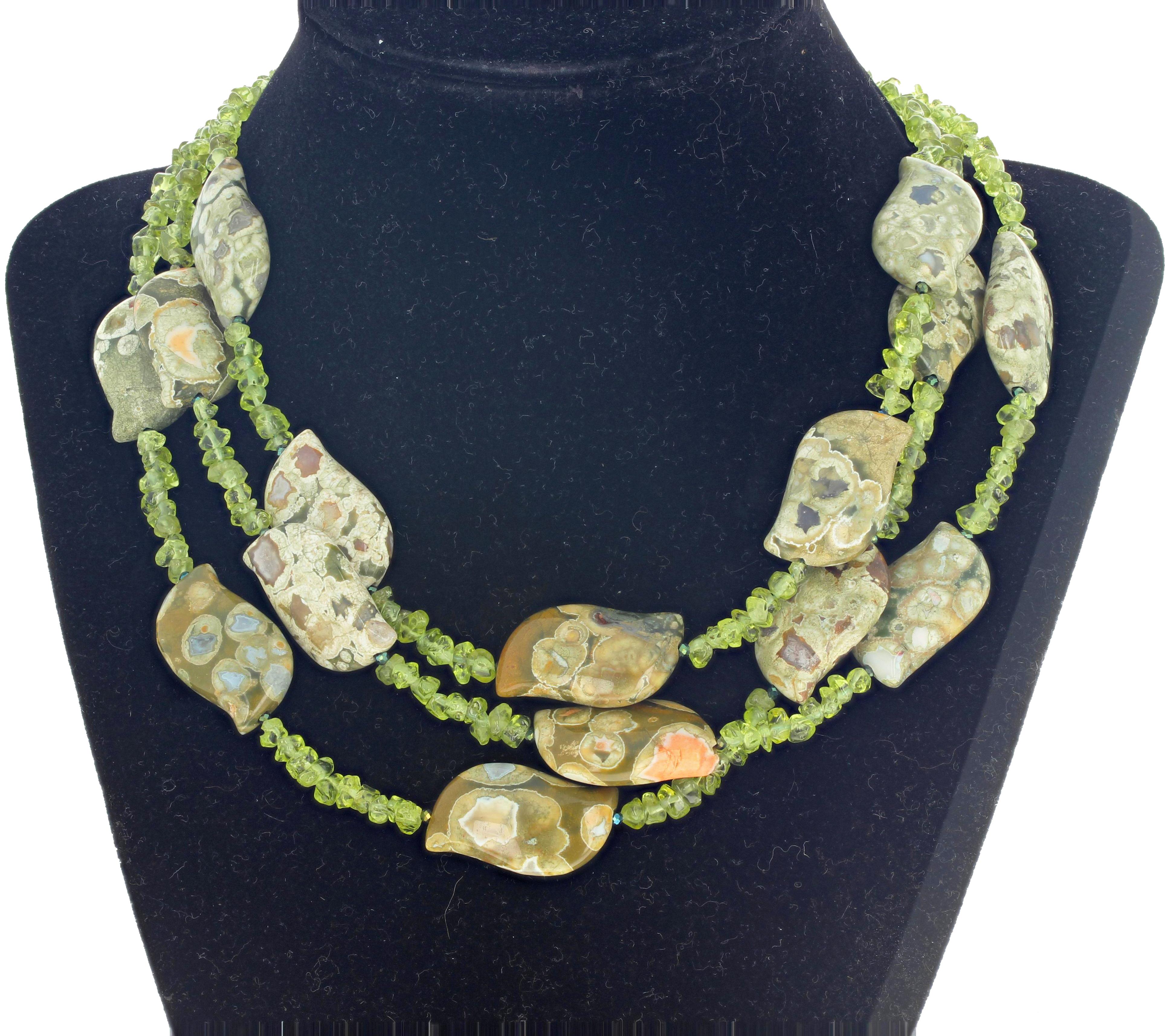 Artistically polished unique natural Jasper swings elegantly with chips of Peridot in this three strand 16 inch long necklace with gold plated easy to use hook clasp.  The Jasper is approximately 26 mm long.   