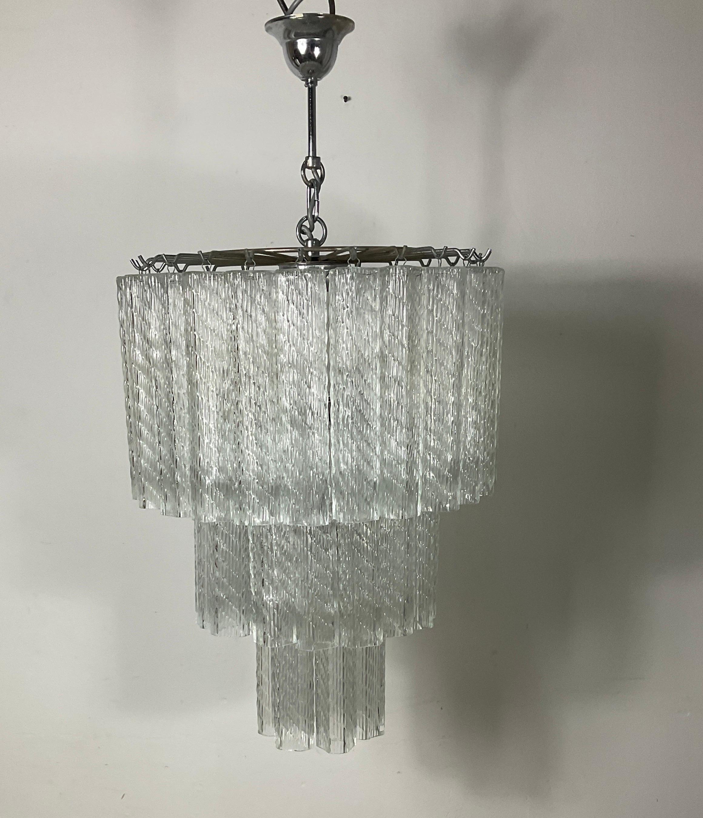 Splendid Venini Murano chandelier made on three levels of the 70s, gold-coloured tubes no. 8 lights, spectacular effect. Excellent state of preservation. Chrome-plated structure. Paolo Venini, (born 1895 – died in July 1959, Venice, Italy), Italian