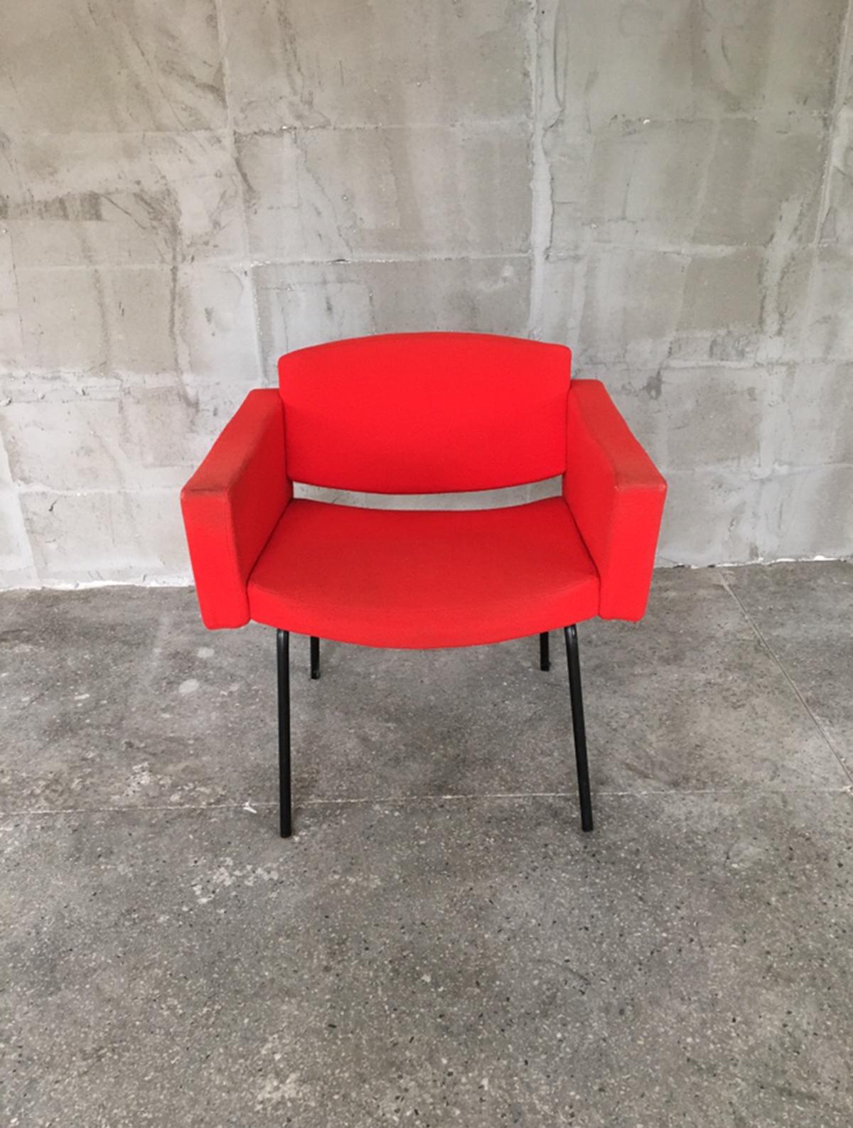 This originally red armchairs has black lacquered metal structures with red fabric upholstery. It was designed by Pierre Guariche for Meurop between in the 1960s.