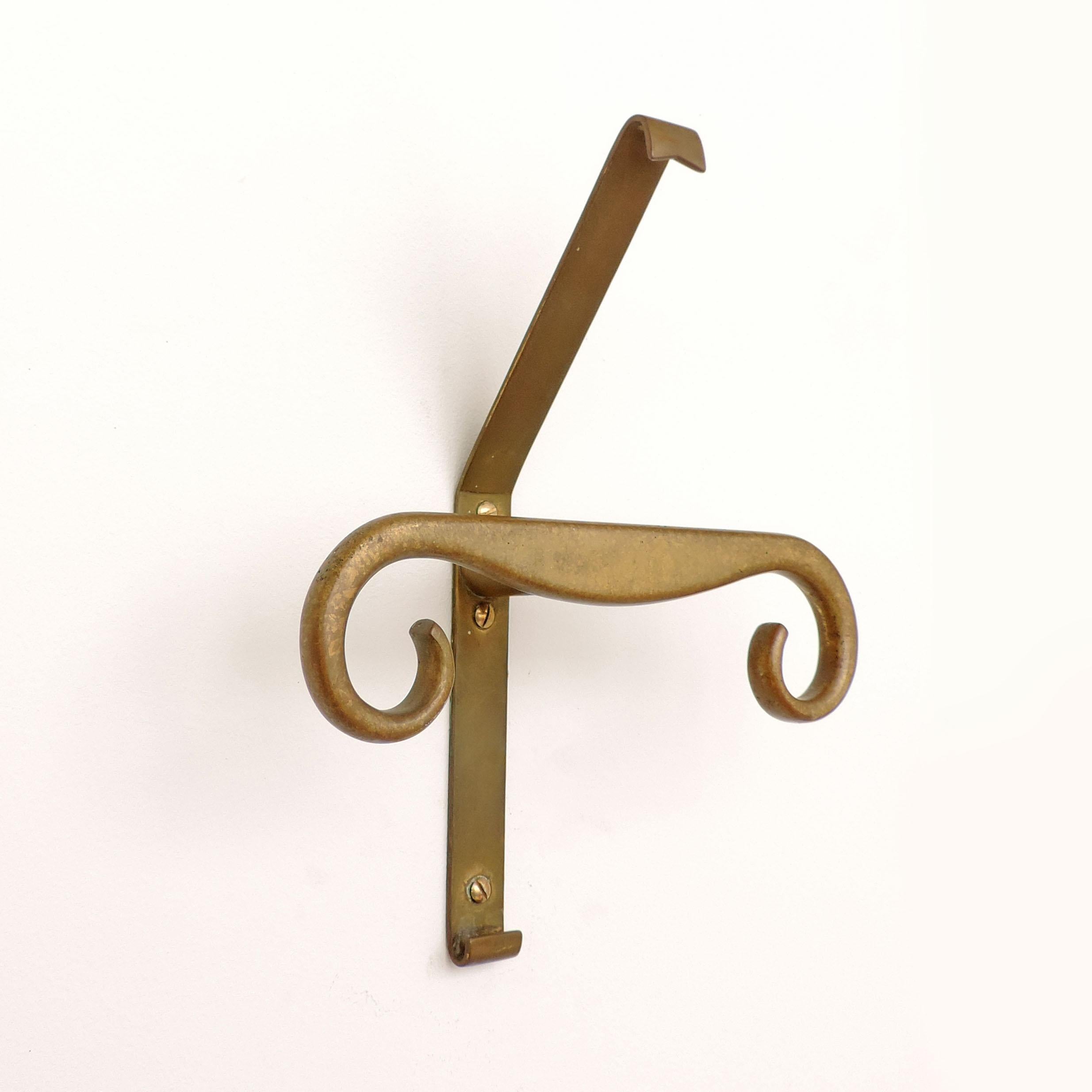 Five Sculptural large Italian brass coat hangers, 1940s
five pieces are available.
  
  