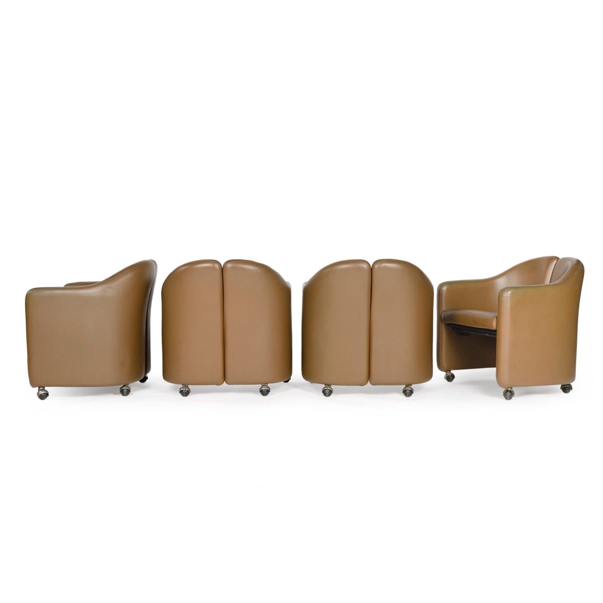 A fully upholstered split barrel-back desk or cocktail chair, Tecno model 142, in original vinyl upholstery on casters.