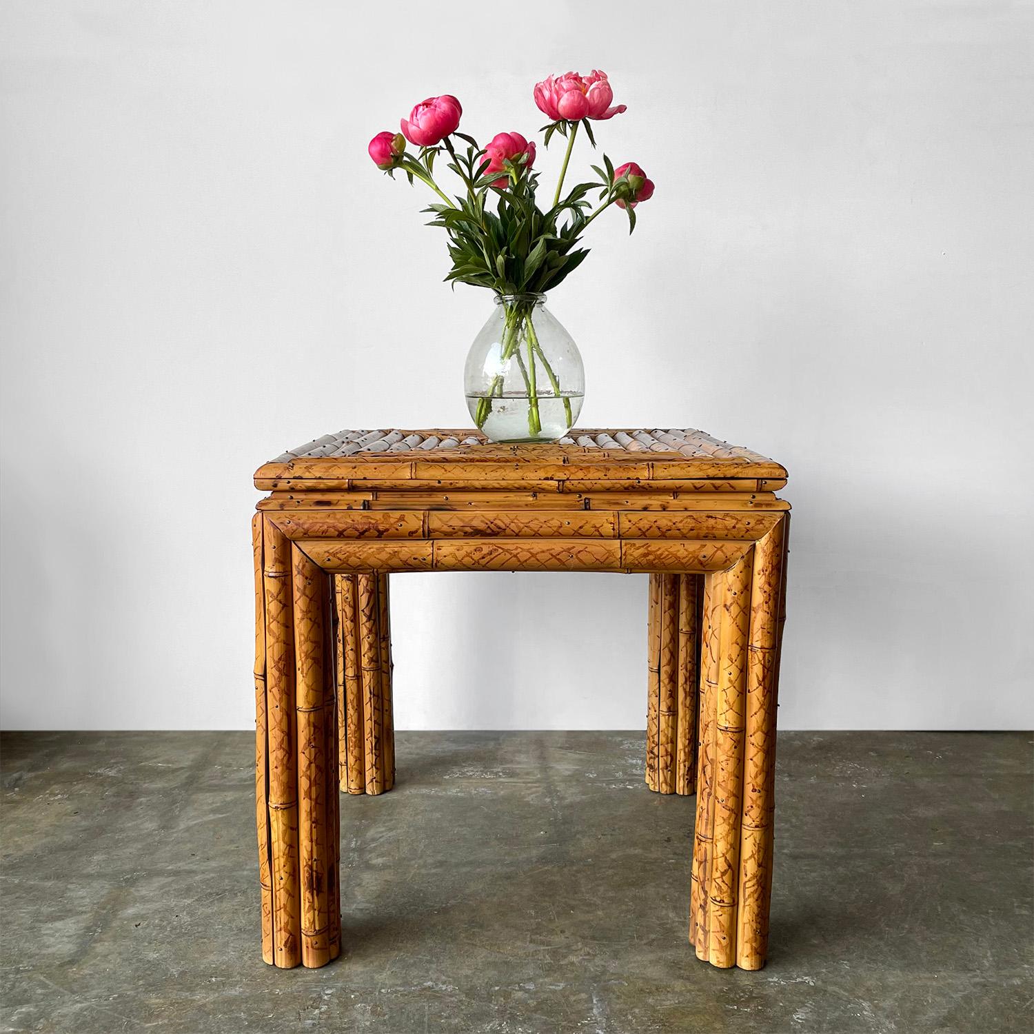Split bamboo table
Circa 1970’s
Wonderful entry or statement piece
Handcrafted piece with great attention to detail
Table surface is comprised of centrifugal squares
Nailhead rivet details throughout
Patina from age and use