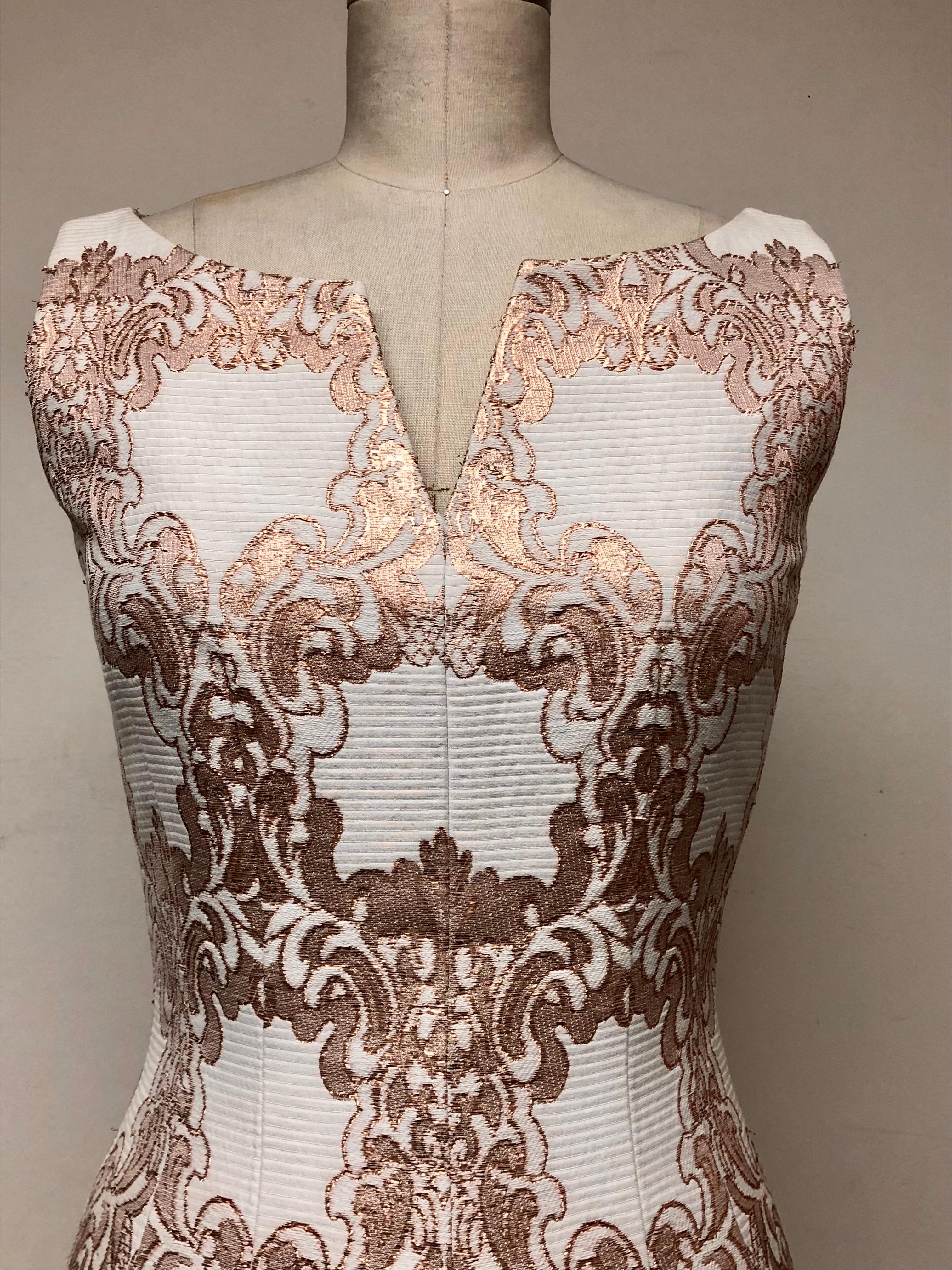 Always elegant! Fits like a glove! Split bodice column gown with front slit—double darts in front and back give it a beautiful shape. French cotton brocade. Fully lined in silk. Gold embellished Byzantine-inspired cotton Ottoman gives it an ornate,
