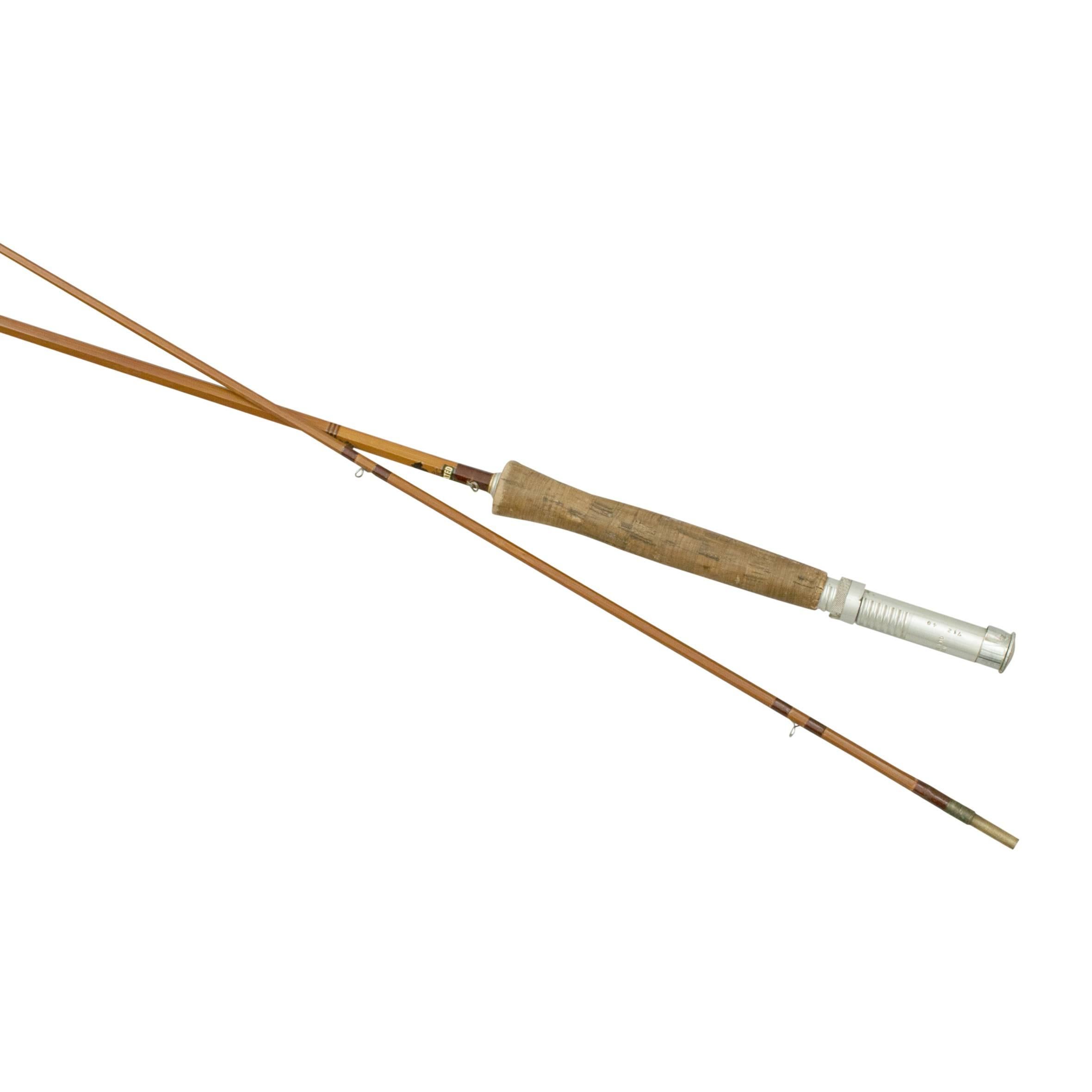 Trout fly fishing rod, The Merlin.
A fine 6ft, 2 piece split cane trout fly rod, The Merlin by Falcon of Redditch. The split bamboo brook rod is with suction joint, green whipped snake rings, alloy reel ring and cork handle. The inscription