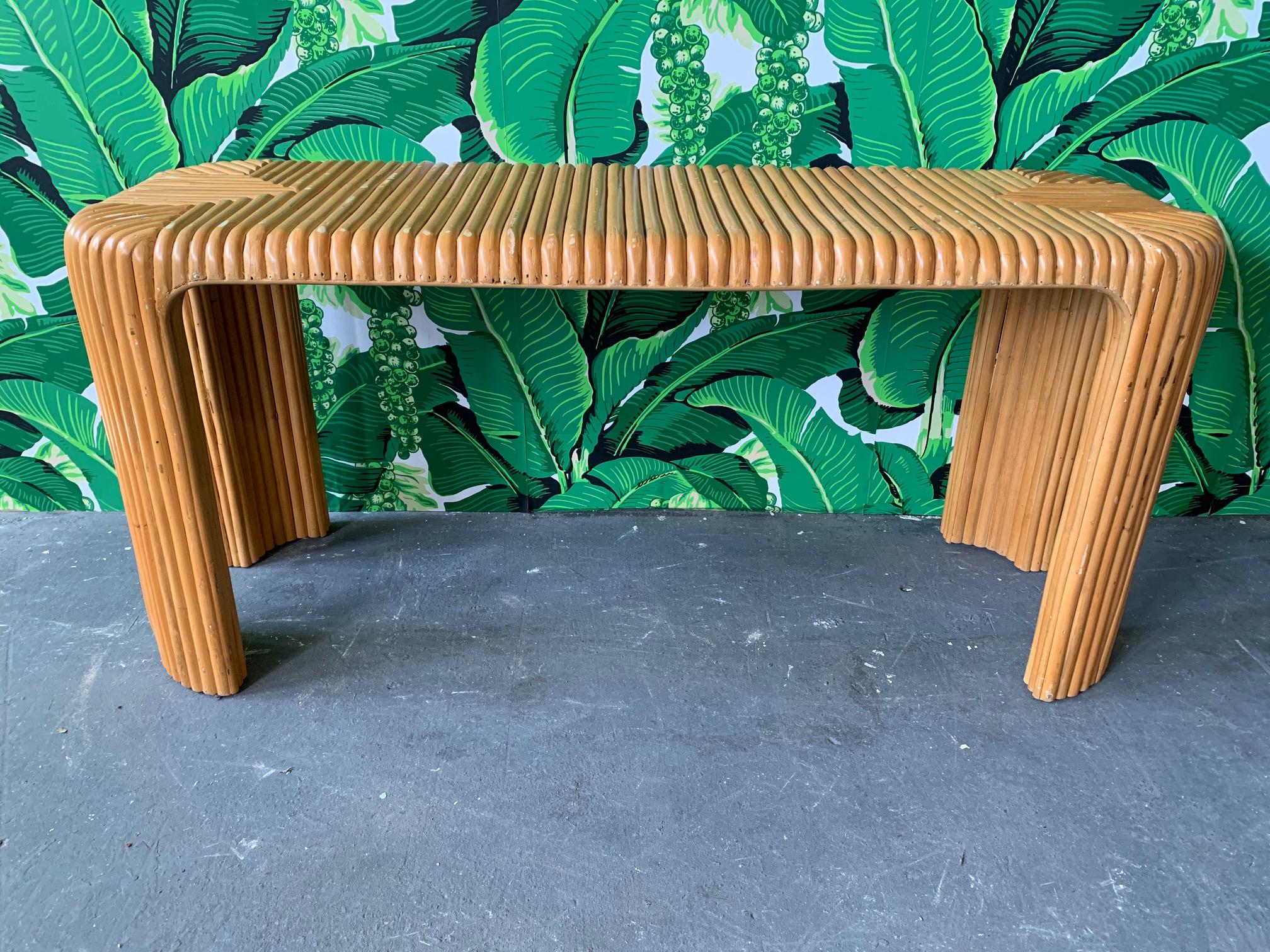 Vintage console or sofa table features split reed bamboo veneer in a distinctive geometric pattern. Good vintage condition with minor abrasions consistent with age. Made in Indonesia.