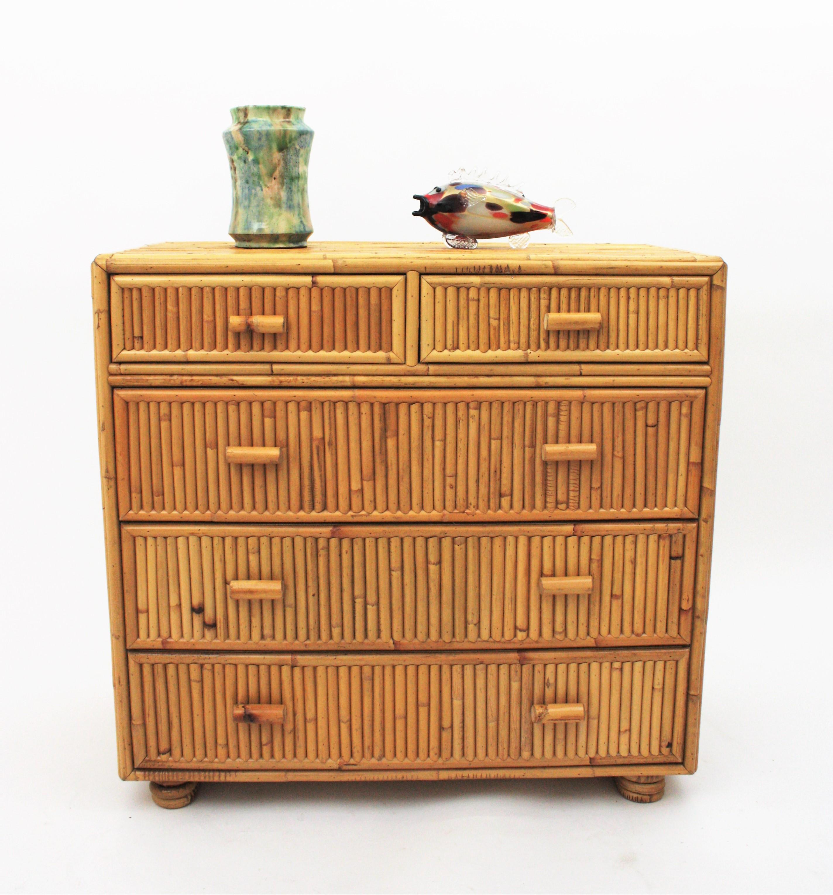 Spanish modernist rattan bamboo five-drawer chest or commode, 1970s
Nice Mid-Century Modern split reed rattan and bamboo commode or chest of drawers.
All made with wood covered with bamboo canes.
This beautiful commode has 5 drawers accented by