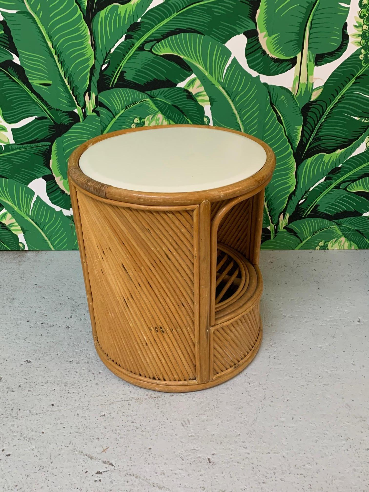 Split reed rattan wrapped side table features pass-through shelf and vinyl covered top. Very good condition with only very minor imperfections consistent with age.