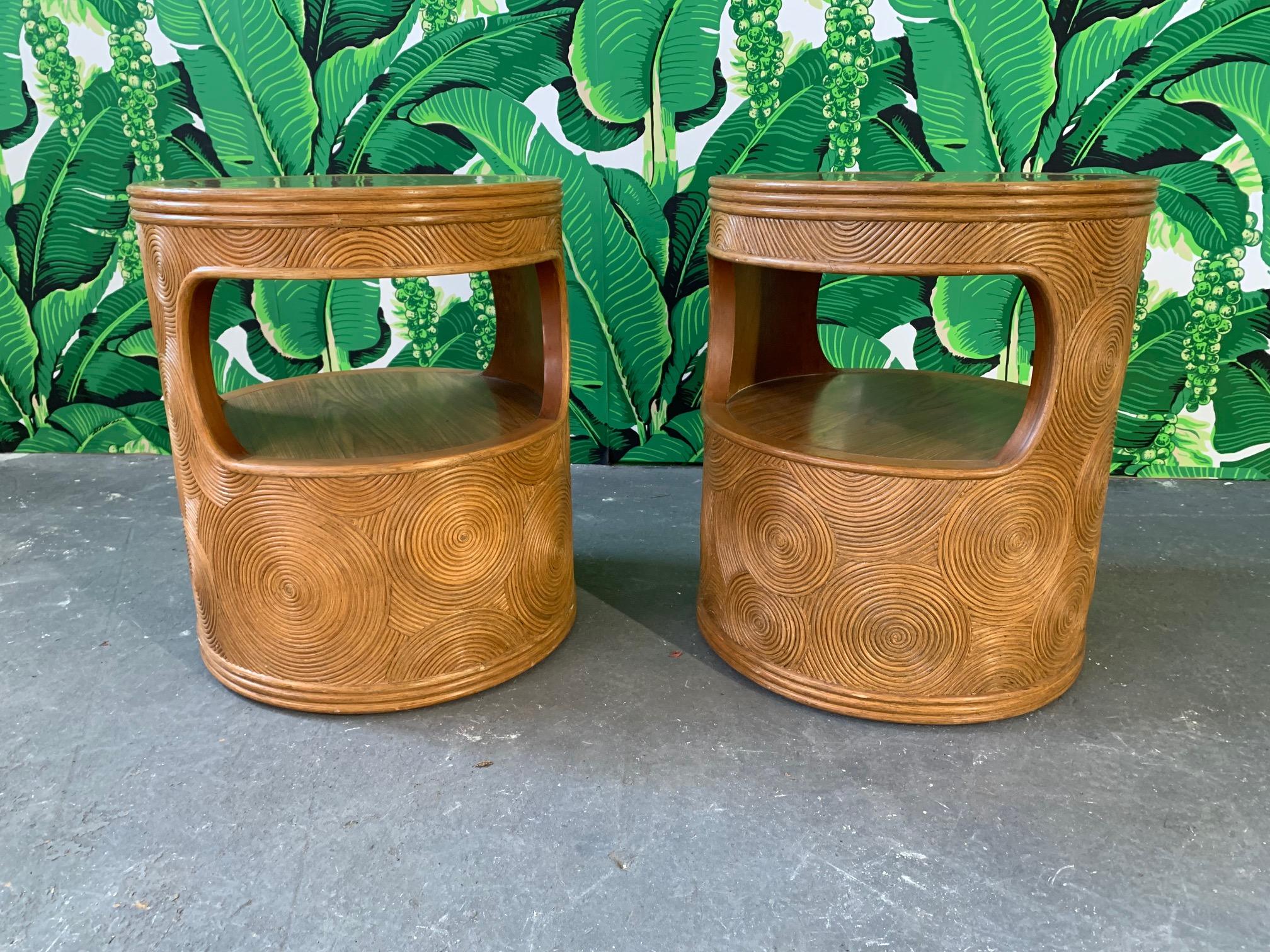 Pair of round side tables feature intricate split reed rattan. Very good vintage condition with only very minor signs of wear consistent with age.