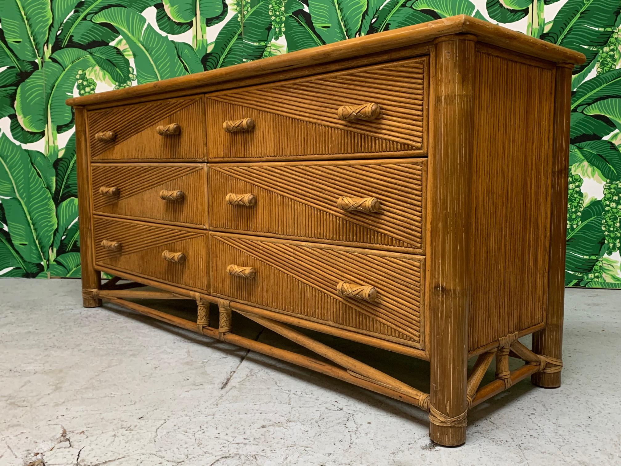 Rattan dresser in the manner of Gabriella Crespi features pencil reed veneered surfaces in a modern geometric design and heavy bamboo detailing. Very good condition with minor imperfections consistent with age.