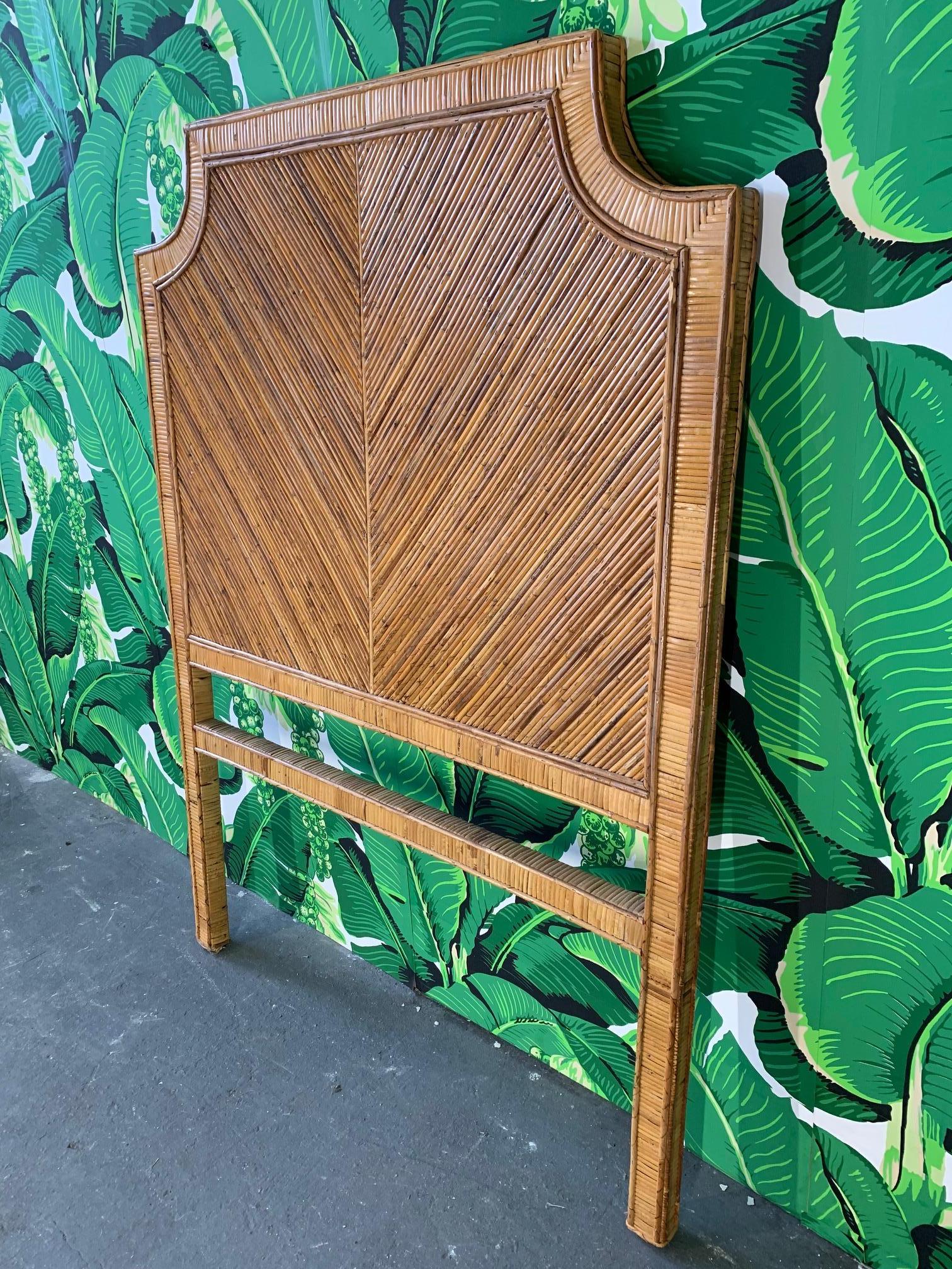Twin headboard wrapped in split reed rattan is a perfect touch of tropical for any decor. Very good condition with only very minor imperfections consistent with age.
