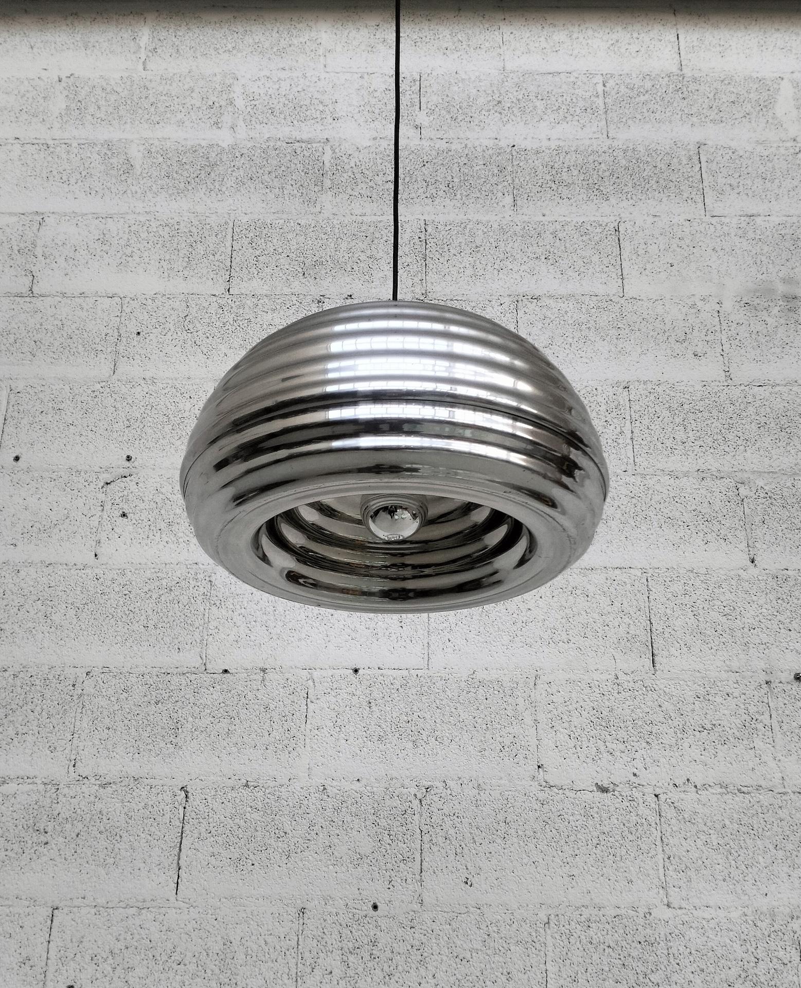 Pendant light fixture with direct light. Reflector in turned aluminum, polished and protected by a transparent varnish.

Achille Castiglioni (1918 - 2002) and Pier Giacomo Castiglioni (1913 - 1968) were born in Milan where they began their
