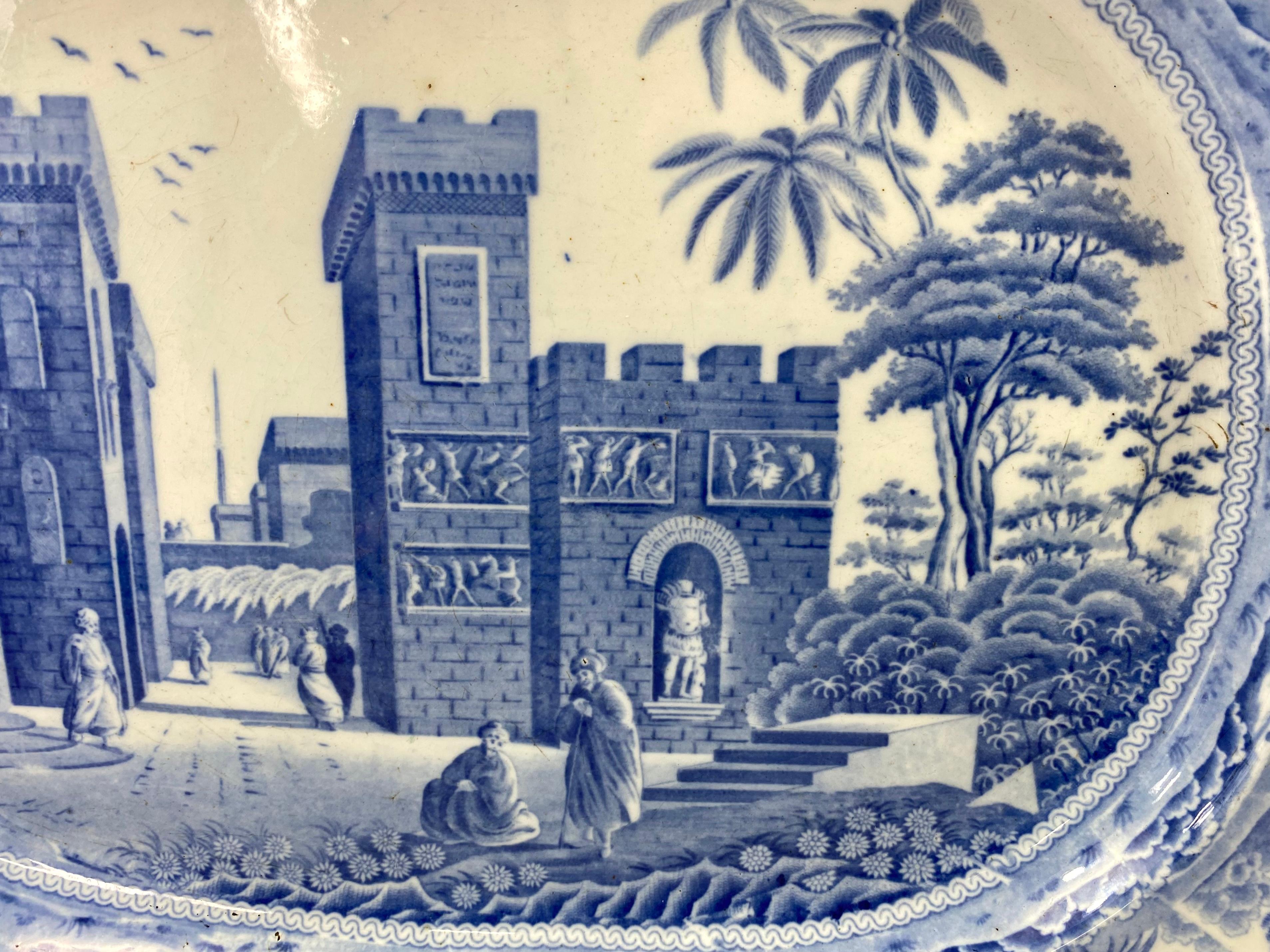 A fine Spode transfer printed large meat dish, c. 1815. Printed in underglaze blue with ‘The Castle of Boudron in the Gulf of Stancio’ after an engraving taken from a drawing by Luigi Mayer.
Within a border from the ‘Indian Sporting’ series, of
