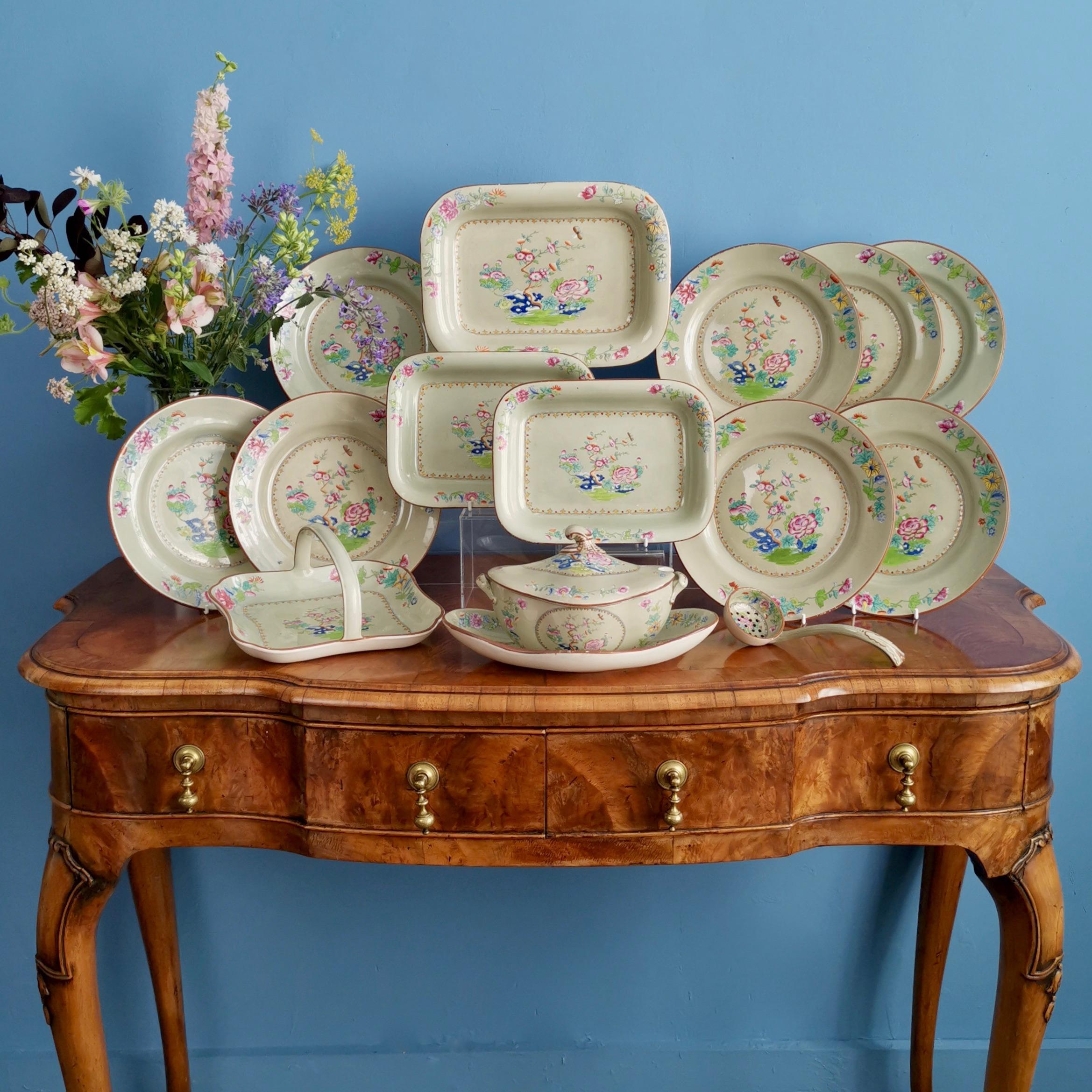 This is a beautiful Spode creamware dessert service made in 1814, which was the Regency era. The service is decorated in a printed and hand-colored Chinoiserie design on an avocado green ground, called the Willis pattern with the number 2147. The