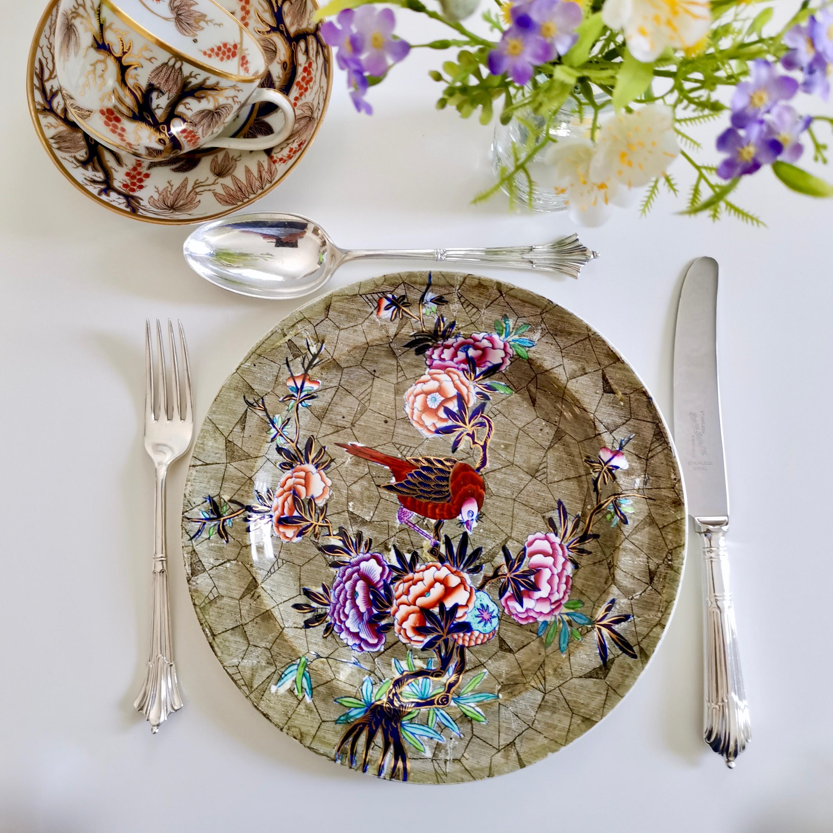 This is a beautiful Spode plate made around 1824. The plate is made of creamware and is decorated with the famous 