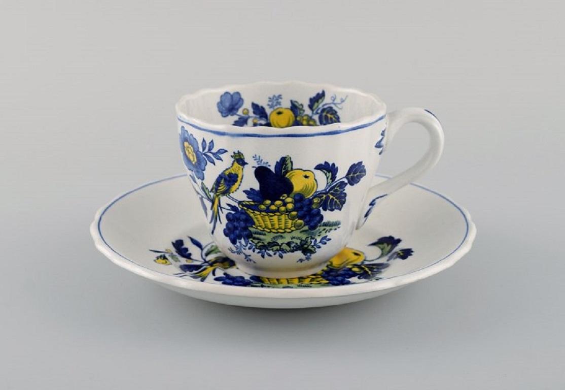 Spode, England. Blue Bird service in hand-painted porcelain. 
Two coffee cups with saucers, two plates, jug and cake stand. 1930s / 40s.
The cake stand measures: 31 x 7.5 cm.
The coffee cup measures: 8.3 x 6.7 cm.
Saucer diameter: 15.5