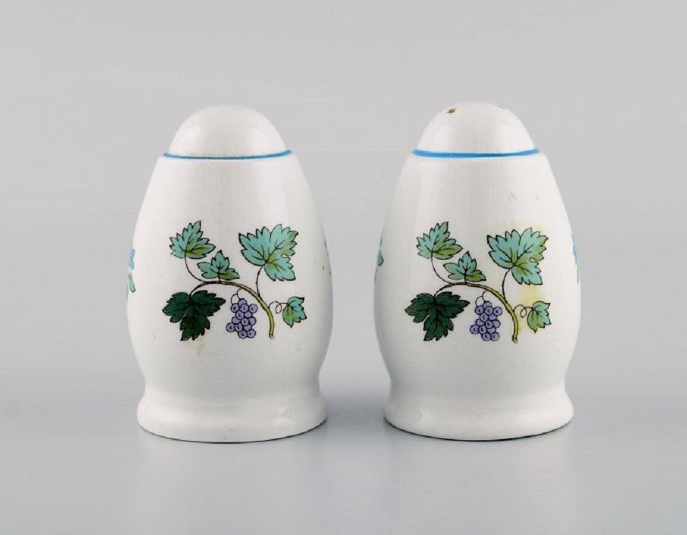 Spode, England. Four Mulberry egg cups, caviar bowls and salt/pepper shaker in hand-painted porcelain. 
1960s / 70s.
Egg cup measures: 6 x 5 cm.
The salt shaker measures: 7 x 4.7 cm.
The caviar bowl measures: 7.5 cm.
In excellent
