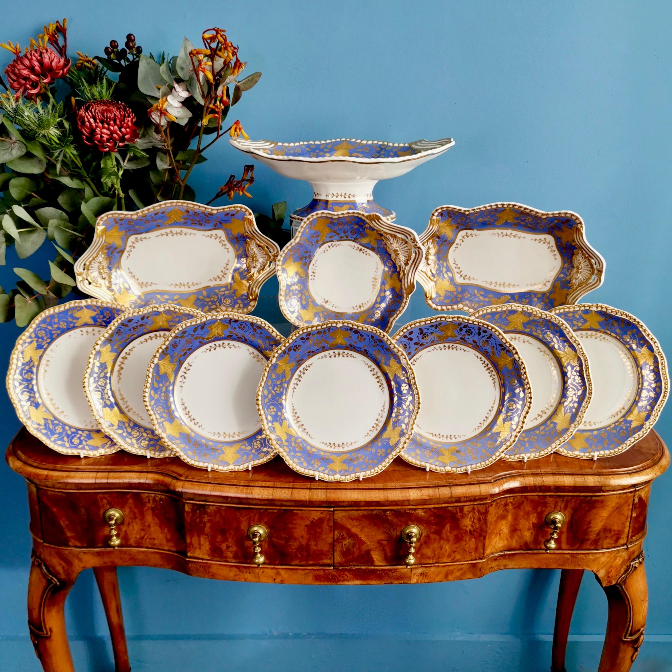 This is a stunning dessert service made by Spode in 1828, which was the Regency era. The service is made of Felspar porcelain and decorated in a beautiful periwinkle purple colour with a raised gilt vine pattern. The service consists of a large