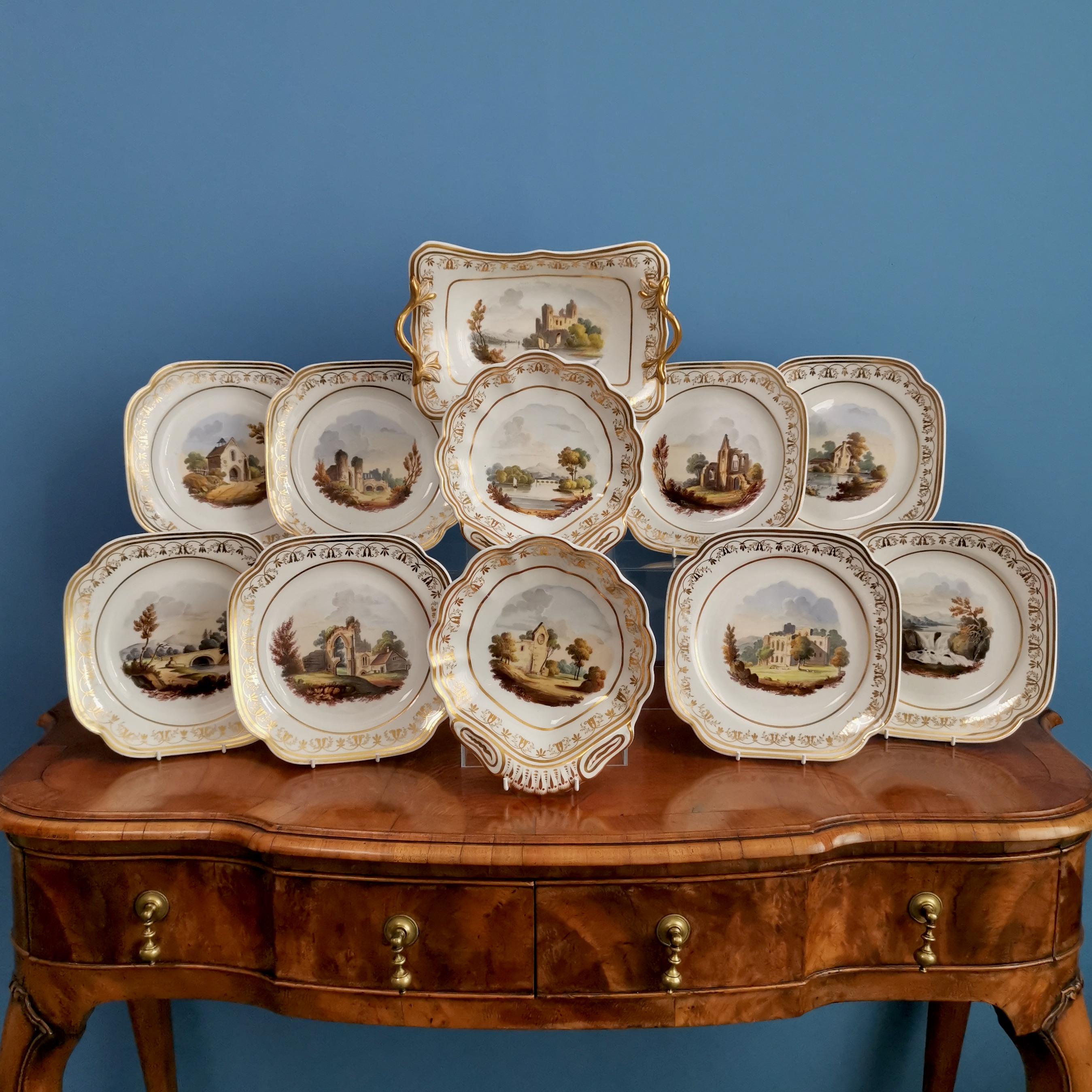 This is a stunning dessert service made by Spode in about 1820, which was the Regency era. The service is made of Felspar porcelain and decorated with beautiful hand painted landscape scenes. The service consists of one rectangular dish, two shell