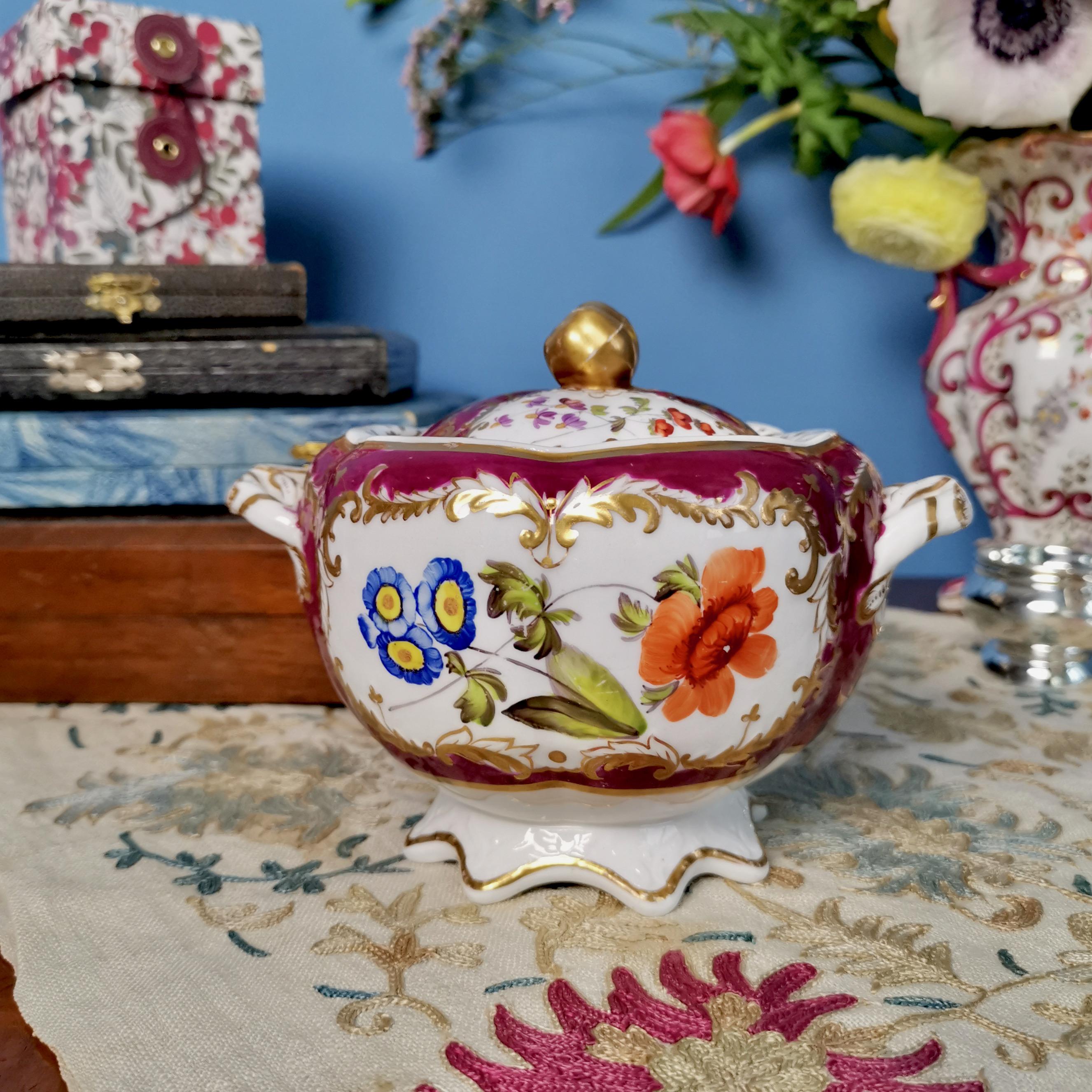 This is a beautiful lidded sucrier made by Spode around the year 1830. The sucrier is made in Felspar porcelain and has a bulbous shape, maroon ground color and stunning flower paintings.

Spode was the great Pioneer among the Georgian potters in