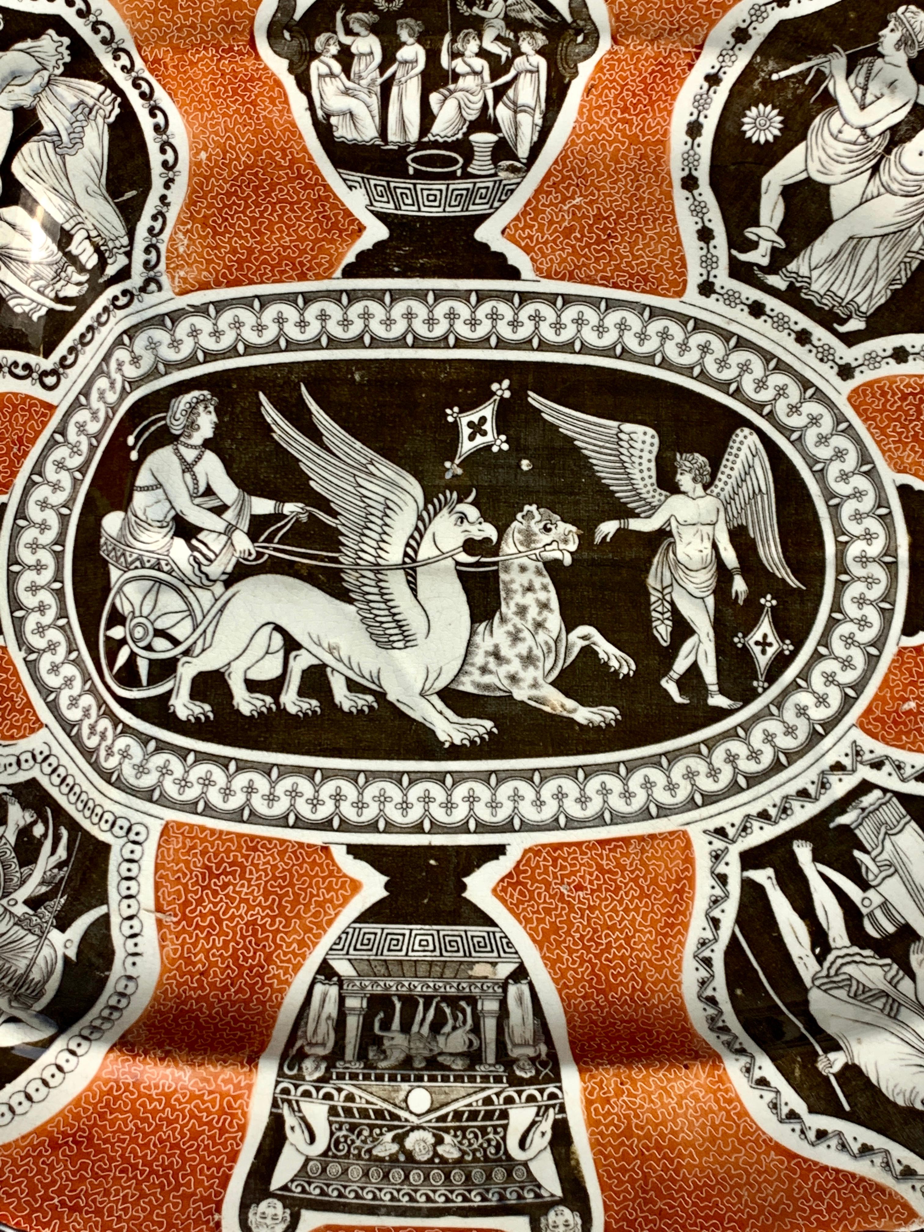 This exquisite Spode Greek ware platter with well and tree was made in England circa 1820.
The platter displays a rare combination of colors: brown on iron red.

The fabulous center scene is known as 