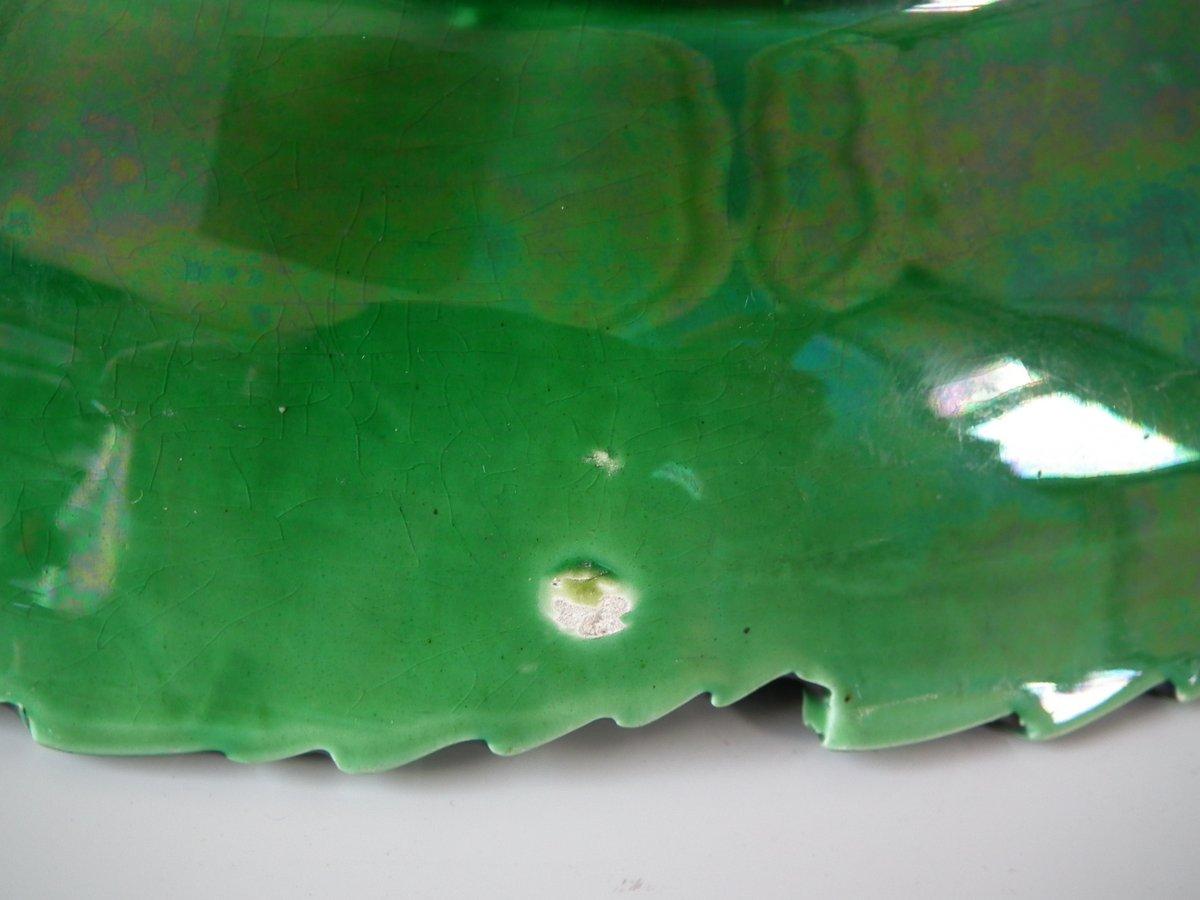 Spode Majolica platter which features overlapping leaves. Coloration: green, are predominant. The piece bears maker's marks for the Spode pottery.