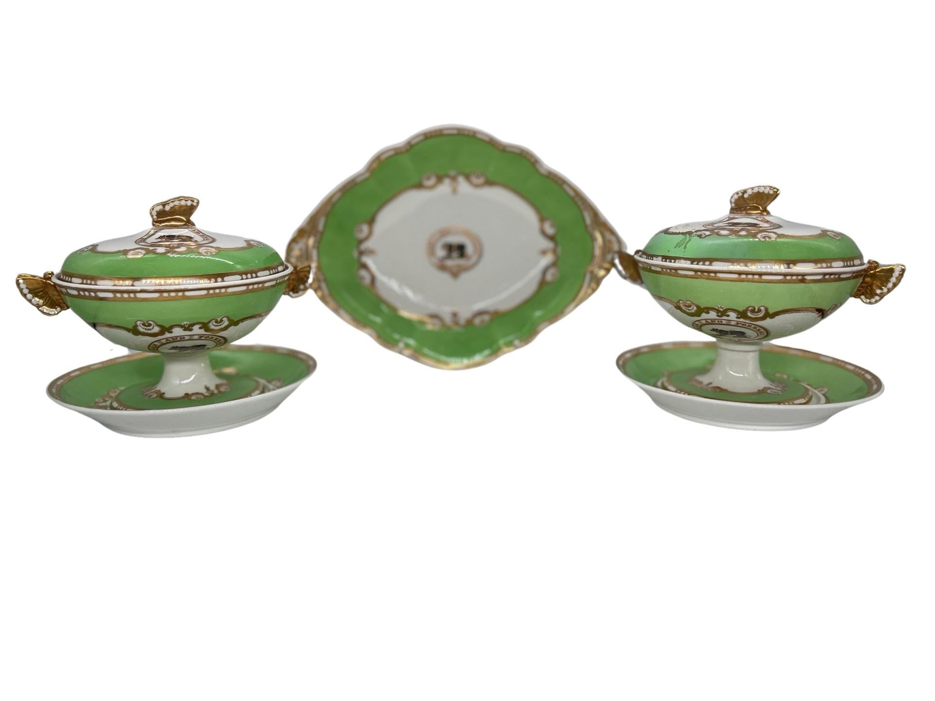 Spode (England, Founded 1770), Felspar Porcelain (Introduced 1821), circa 1840.

A 3 piece grouping of antique Spode Felspar porcelain including a pair of covered sauce tureens and dessert tray. Each piece with an ivy green colored base, accented by