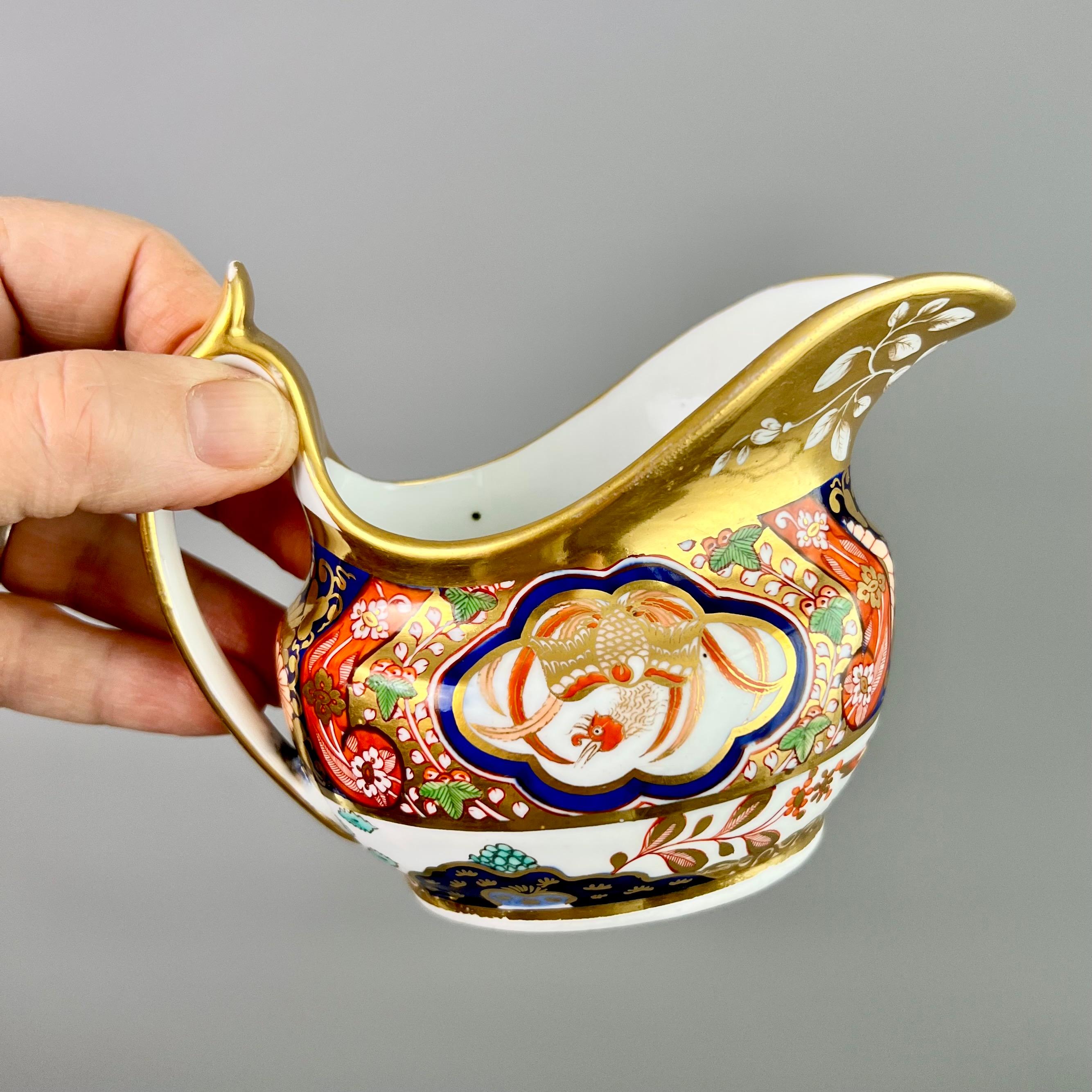 This is a beautiful milk jug or creamer made by Spode around 1808. The jug is decorated in a richly gilded Imari pattern that has also been seen on Nantgarw porcelain, with beautiful birds.

Josiah Spode was the great pioneer among the Georgian