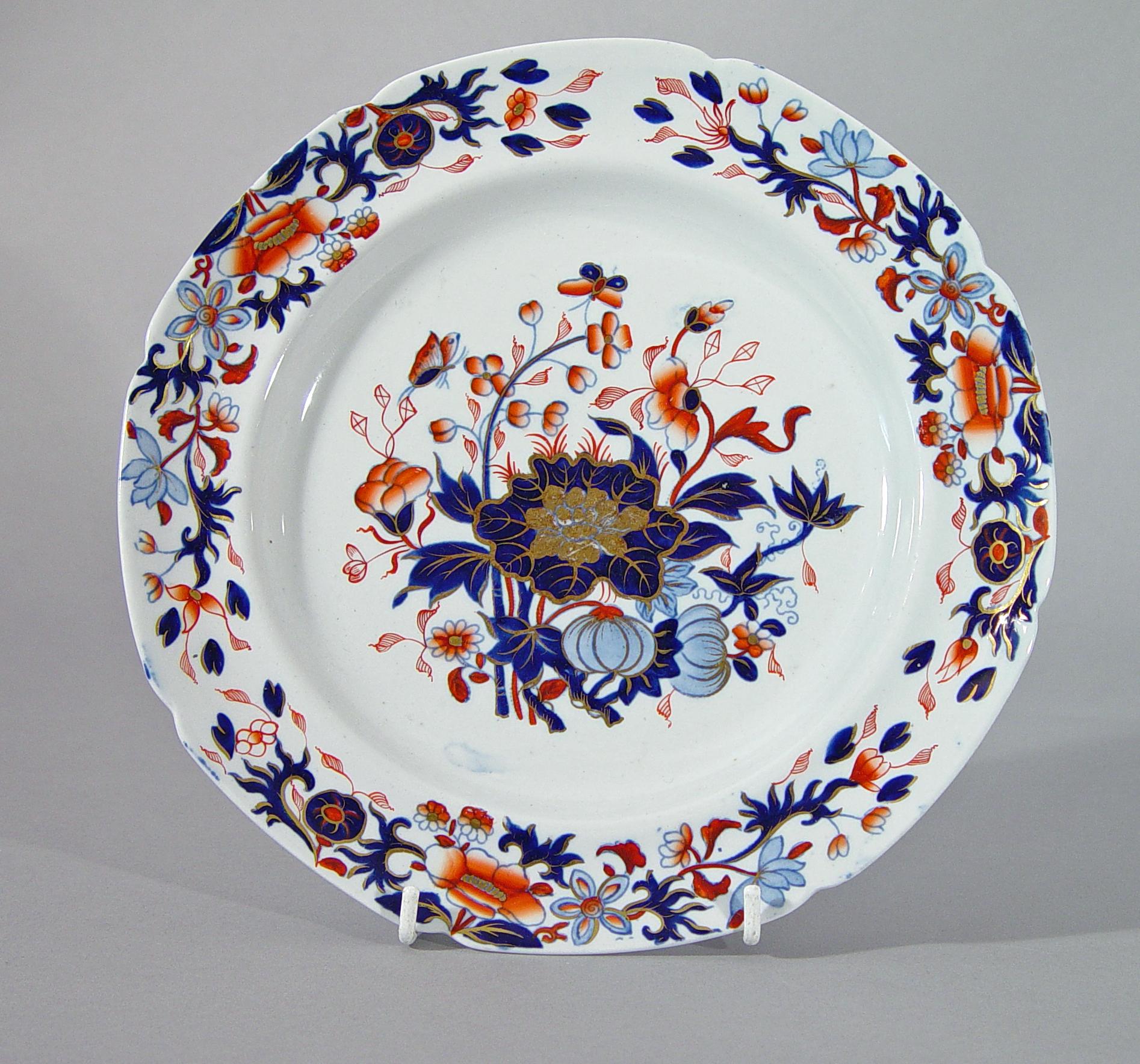 Spode New Stone China Dinner Service- Eighty Four Pieces,
Pattern #3504,
Circa 1820

The service is decorated in an Imari pattern in iron red light and dark blue and gold of a stand of bamboo and other plants in the centre of the plates with a band