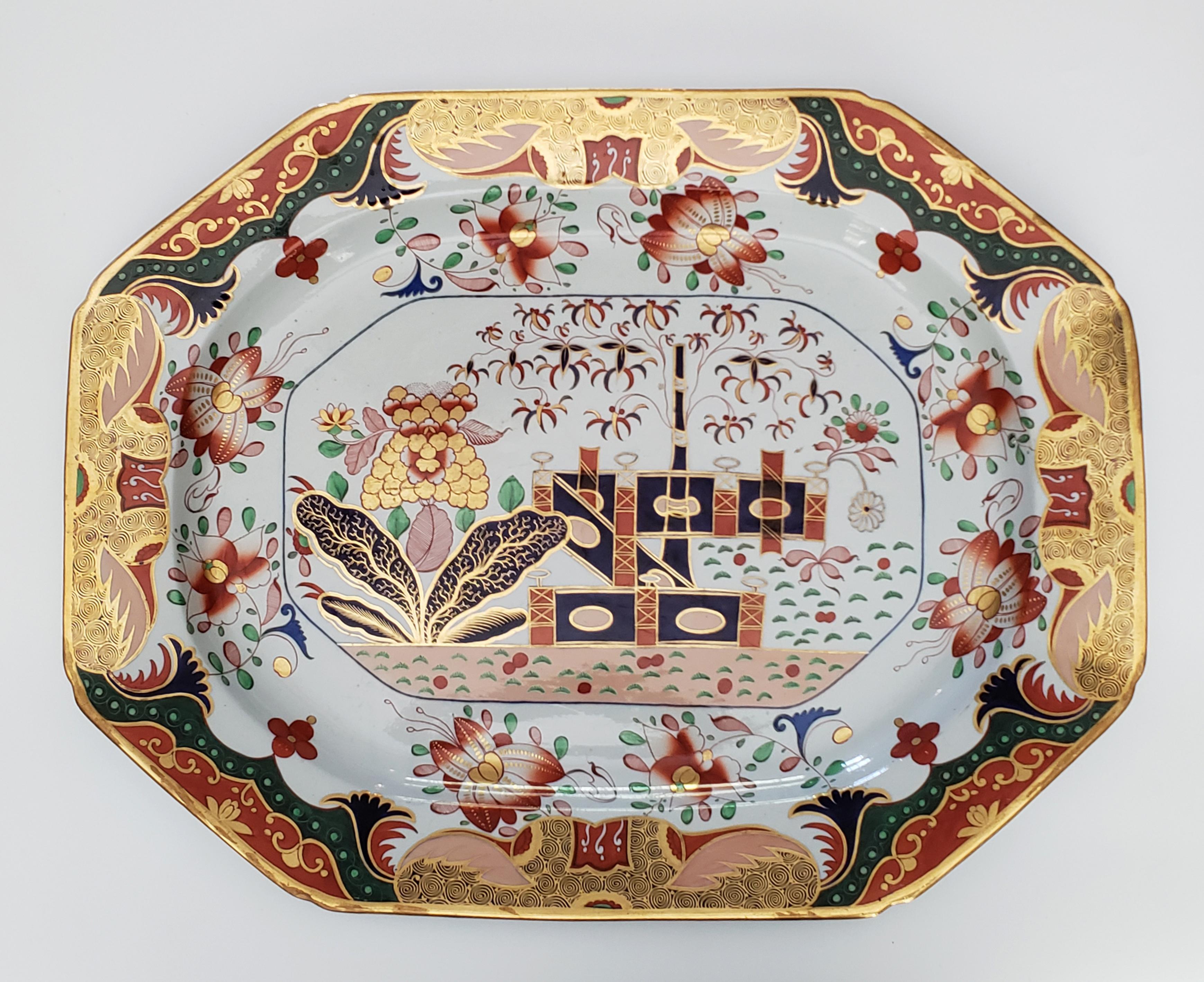 Spode porcelain 967 pattern very large serving dish,
NWith a tray table,
Circa 1810

The very large Spode porcelain serving dish of rectangular shape with canted corners painted with the Spode 967 Chinoiserie pattern and mounted on a wooden stand to