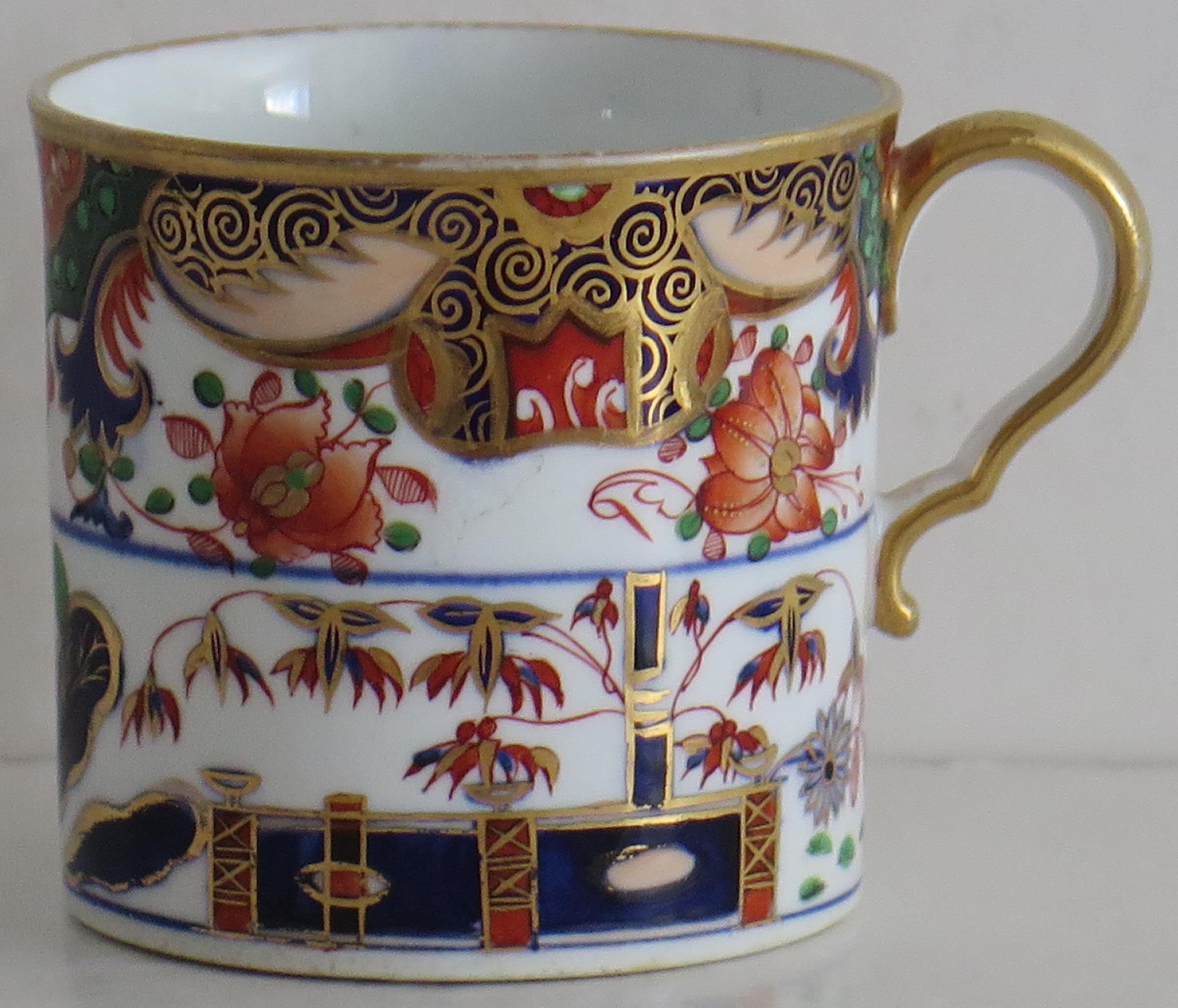 This is a fine example of an English George III period, porcelain, coffee can, made by Spode and hand painted in Pattern 967, during the early 19th Century, circa 1815.

The can is nominally straight sided and has the Spode loop handle with a