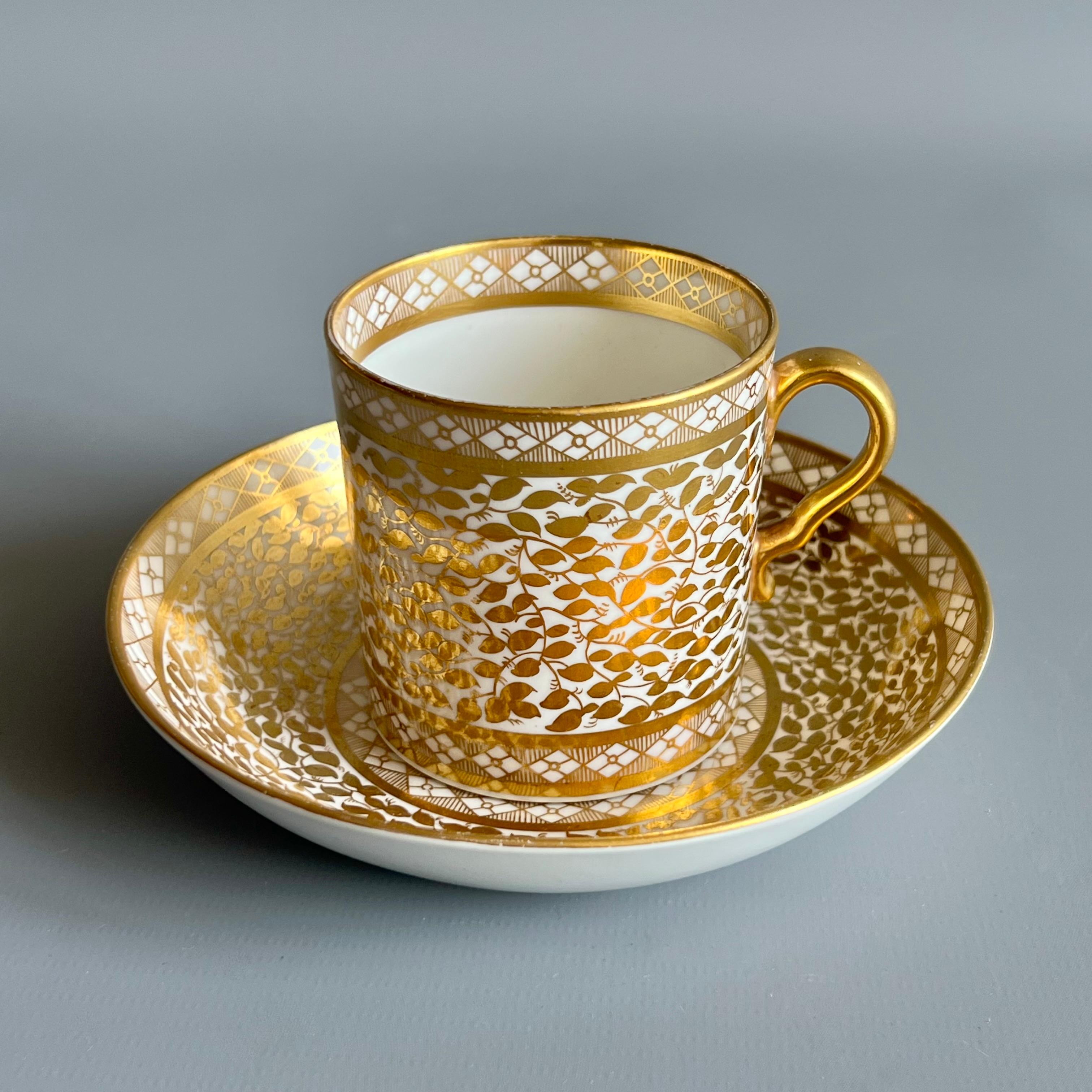 This is a beautiful coffee can and saucer made by Spode around 1804. The set is decorated in a stunning pattern of dense gilt foliage in the Neoclassical taste.

Josiah Spode was the great pioneer among the Georgian potters in England. Around the