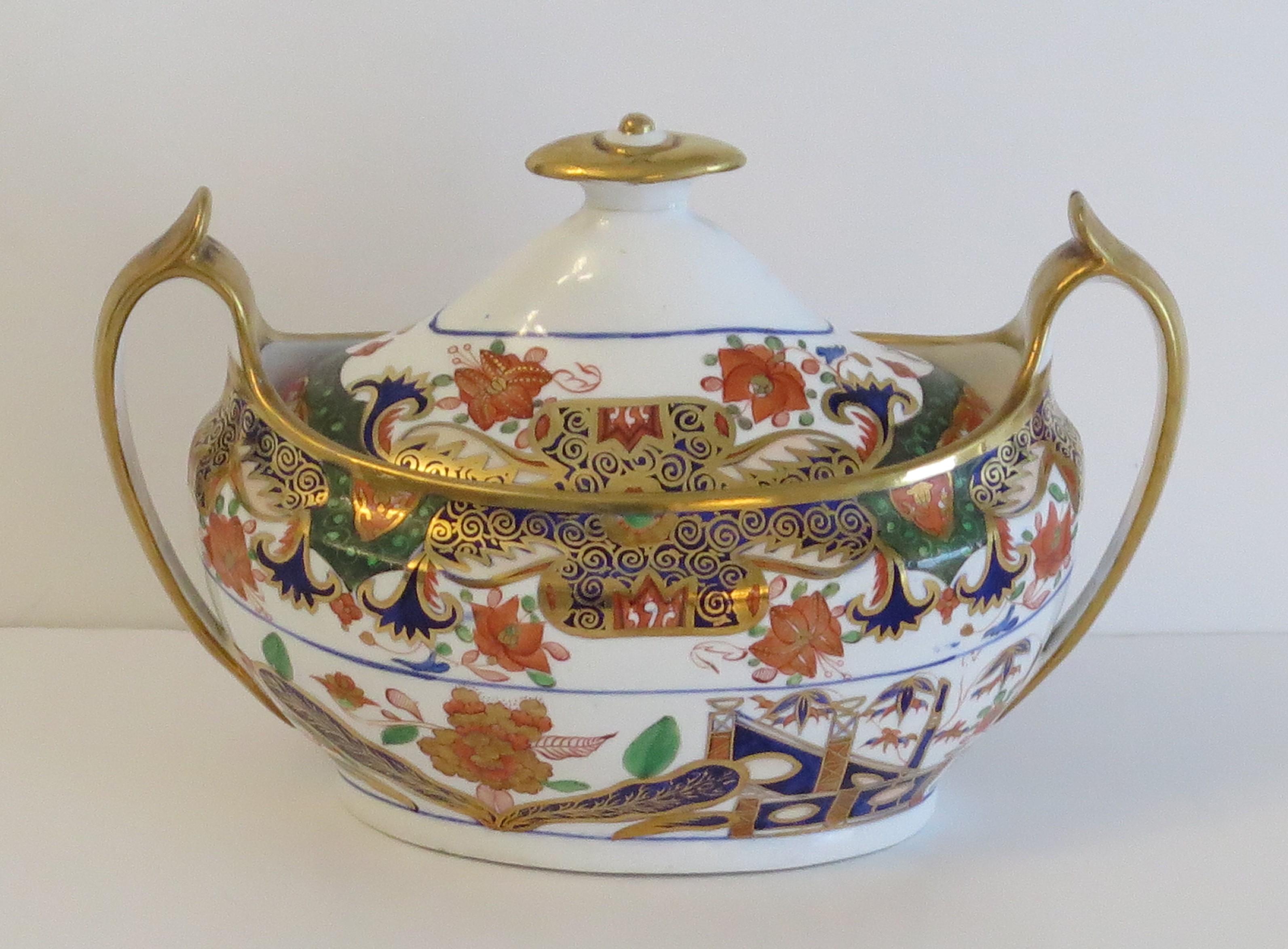 This is a fine example of an English George III period, porcelain, Sucrier with cover or lidded sugar bowl, made by Spode all hand painted in Pattern 967, during the early 19th Century, circa 1810.

This Sucrier has a beautiful and elegant shape