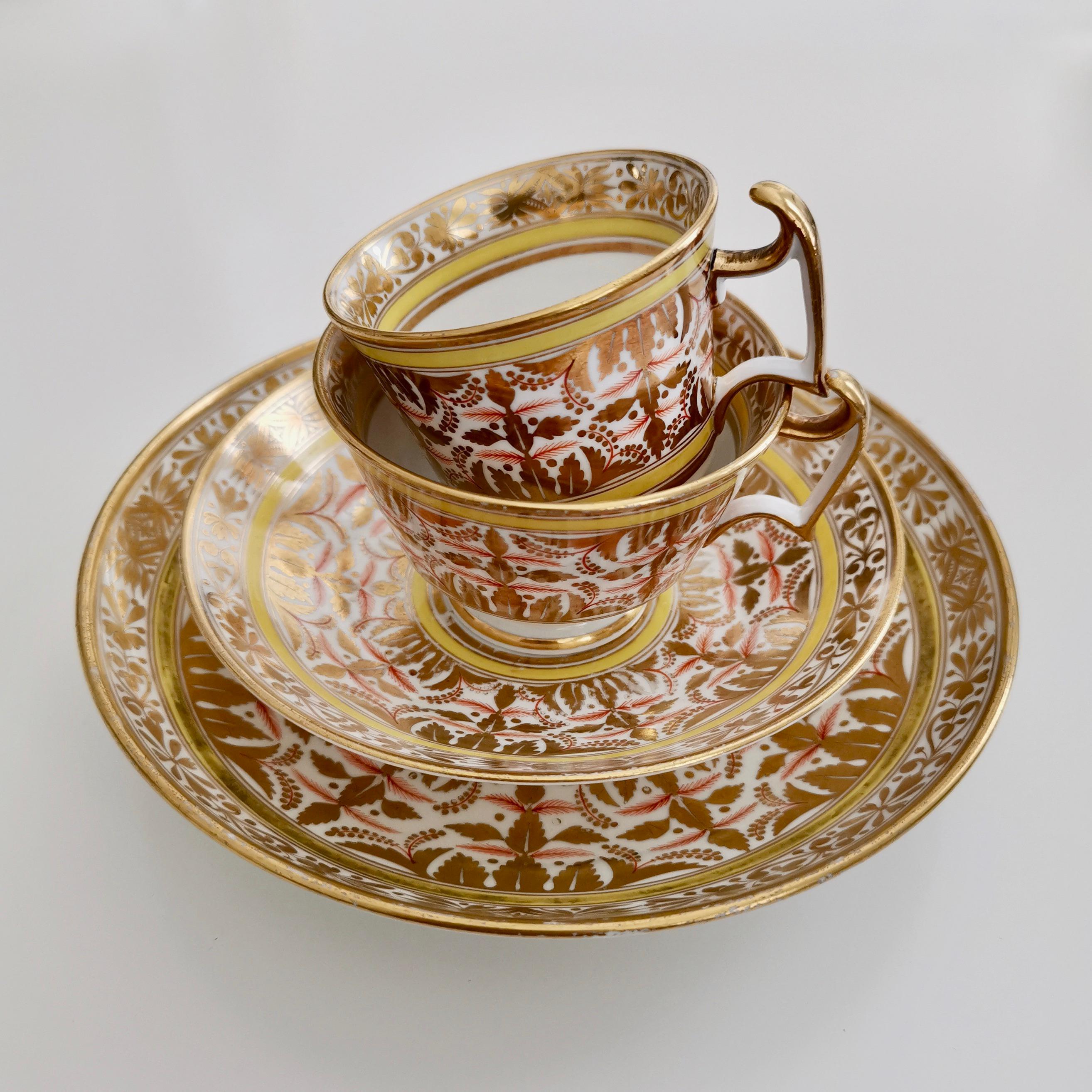This is a beautiful teacup quartet made by Spode in about 1815. It has a beautiful Regency-style pattern of gilt, yellow and red; a very striking colour combination. The set consists of a teacup, a coffee cup, a saucer and a small cake plate. In the