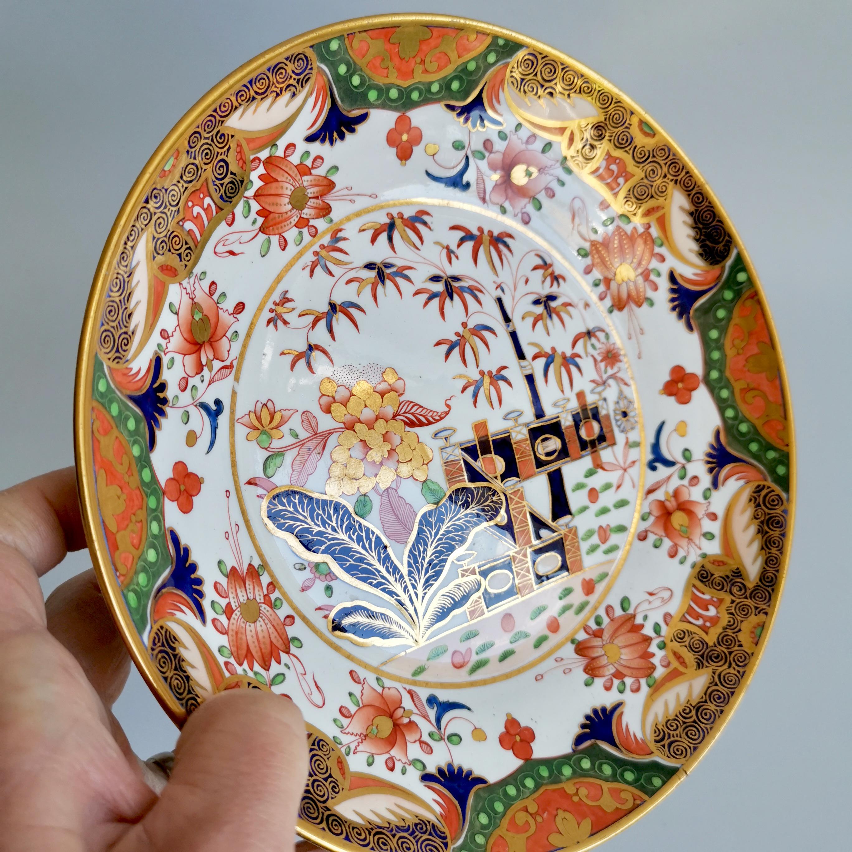 This is a beautiful saucer dish or plate made by Spode around 1815. The plate is decorated in the famous Imari Tobacco Leaf pattern 967. A saucer dish is a deep plate that formed part of a large tea service; it was useful for serving cakes or fruit,