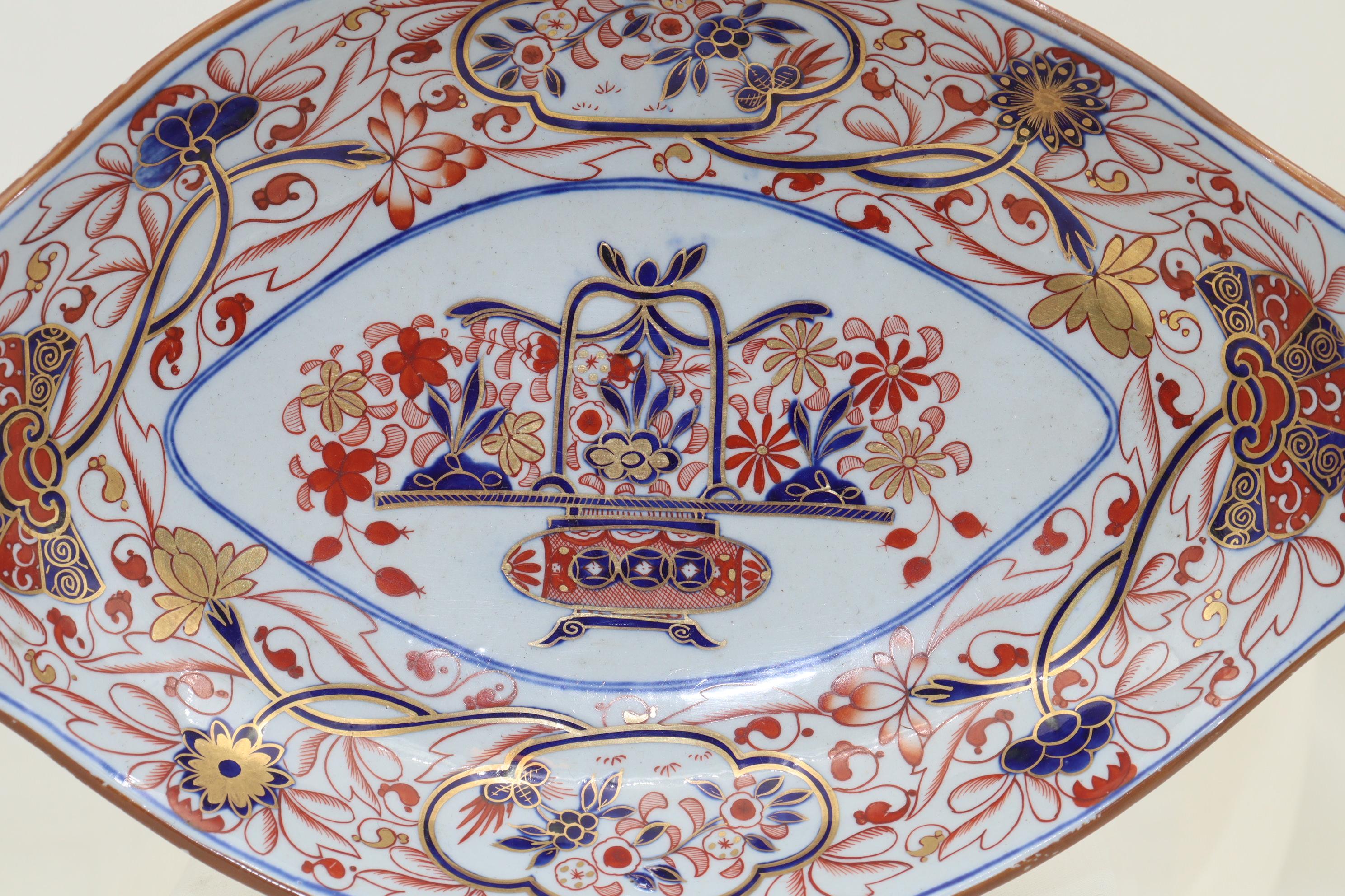 This oval shaped Spode Stone China dish is decorated with a hand painted and gilded Imari pattern (pattern 2283) which was introduced in 1816. The decoration is done using the typical Imari palette of underglaze blue, iron red and gold. The centre
