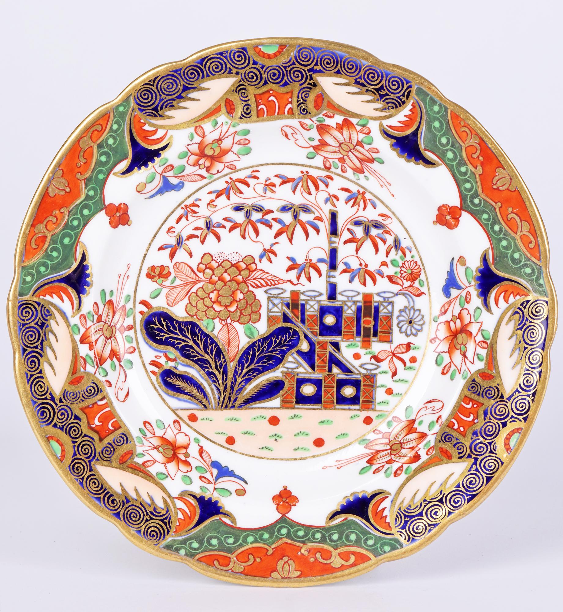 A very fine set of three Georgian Imari pattern decorated porcelain cabinet plates by Spode and dating from around 1810. The small side plates are of rounded form with a raised flat shaped rim and central recess. The plate is very finely decorated